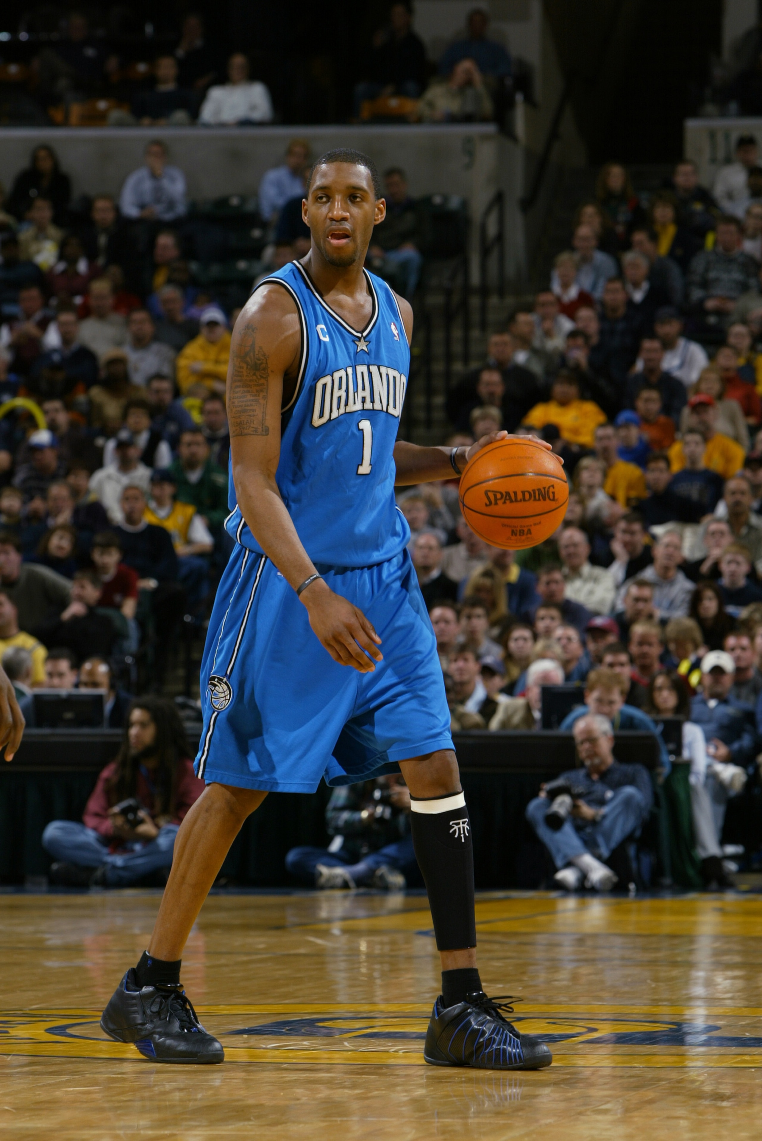 INDIANAPOLIS - DECEMBER 17:  Tracy McGrady #1 of the Orlando Magic moves the ball during the game against the Indiana Pacers on December 17, 2003 at Conseco Fieldhouse in Indianapolis, Indiana.  The Magic won 94-90.  NOTE TO USER: User expressly acknowled