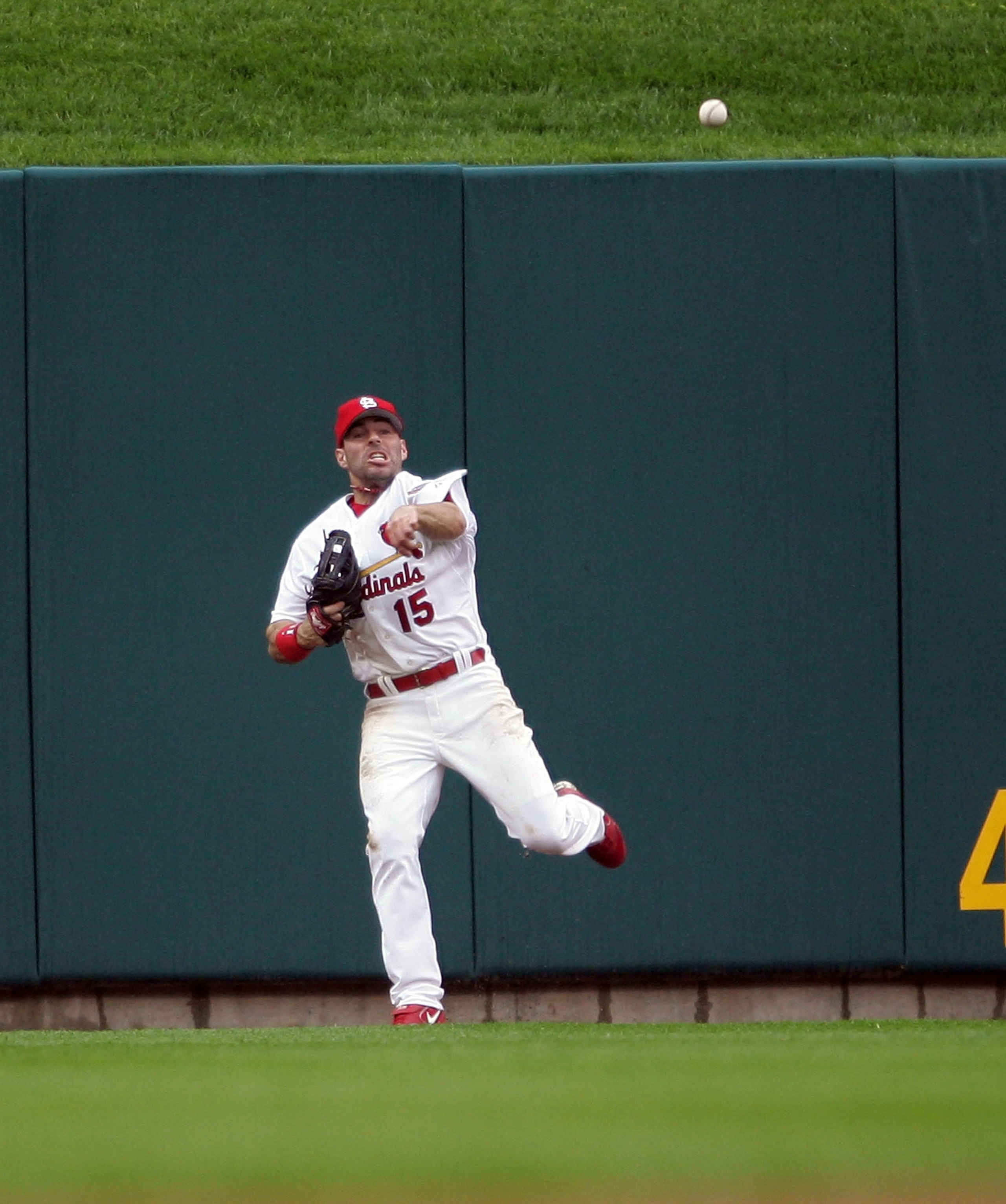 ST. LOUIS - MAY 10:   Jim Edmonds #15 of the St. Louis Cardinals sends the ball infield after he caught a hit by Cory Sullivan of the Colorado Rockies in the seventh inning on May 10,2006 at Busch Stadium in St. Louis, Missouri. The St. Louis Cardinals de