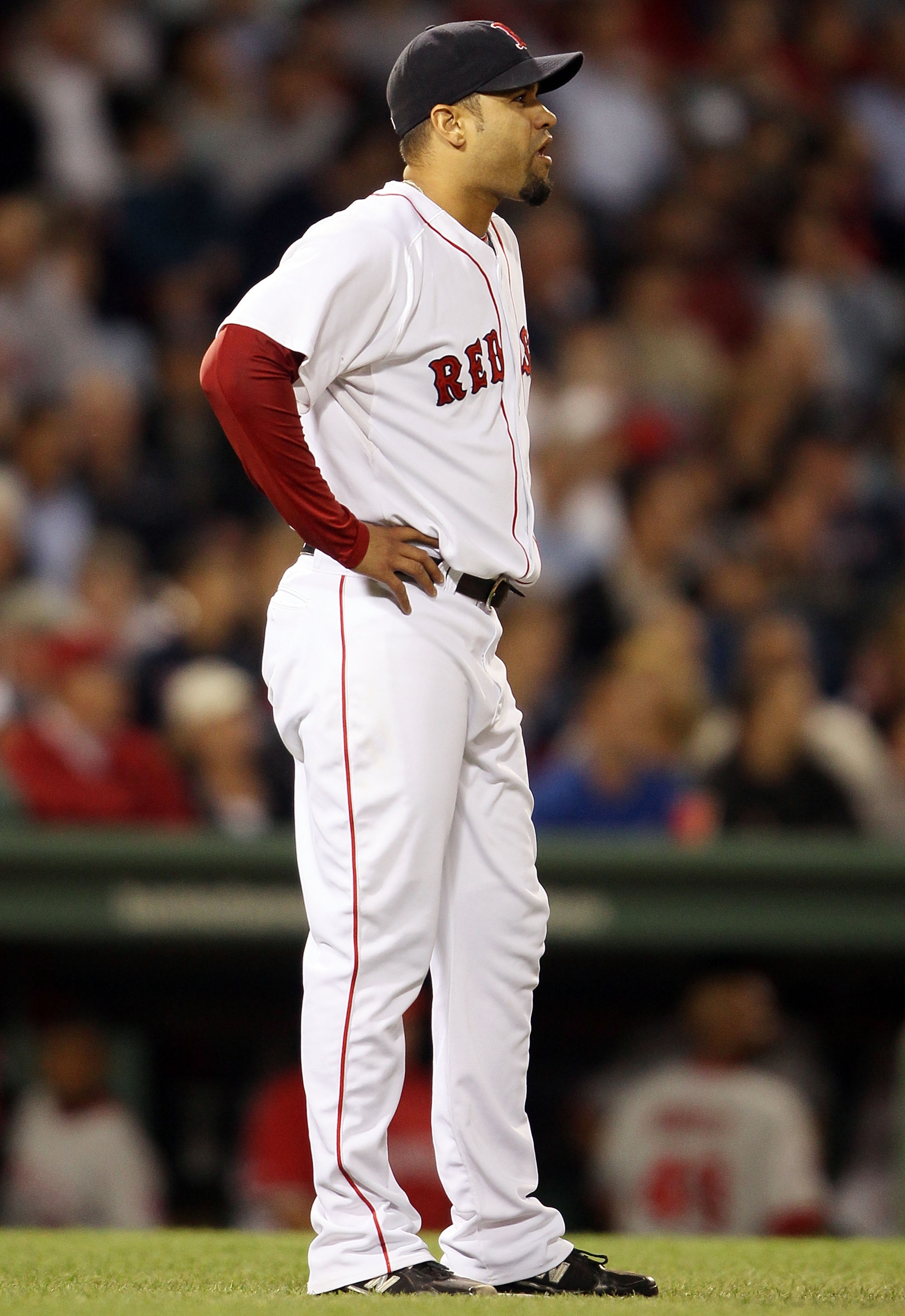 BOSTON - MAY 06:  Manny Delcarmen #17 of the Boston Red Sox reacts after Mike Napoli of the Los Angeles Angels of Anaheim hits a two run homer in the sixth inning on May 6, 2010 at Fenway Park in Boston, Massachusetts.  (Photo by Elsa/Getty Images)