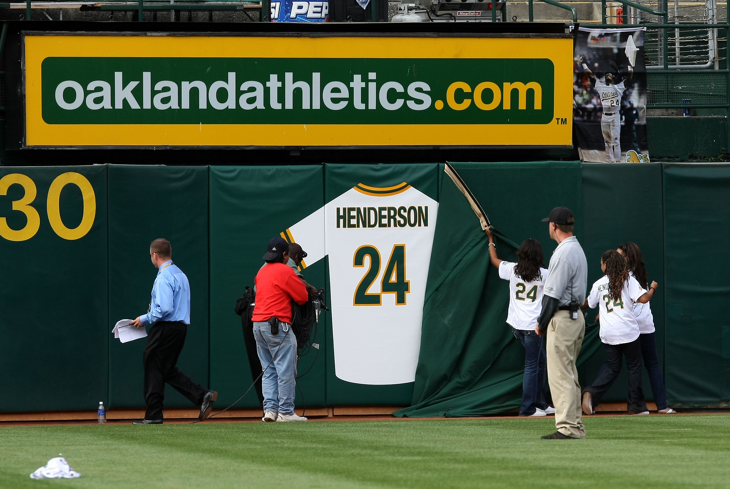 OAKLAND, CA - AUGUST 01:  Hall of Fame baseball player Rickey Henderson's retired jersey is unveiled during a ceremony to retire his number 24 by the Oakland Athletics before the start of the game against the Toronto Blue Jays August 1, 2009 at the McAfee