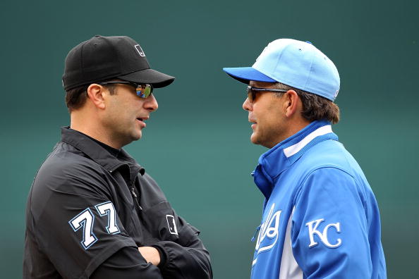 KANSAS CITY, MO - MAY 13:  Manager Trey Hillman #88 of the Kansas City Royals exchanges words with first-base umpire Jim Reynolds #77 during the game against the Cleveland Indians on May 13, 2010 at Kauffman Stadium in Kansas City, Missouri.  (Photo by Ja