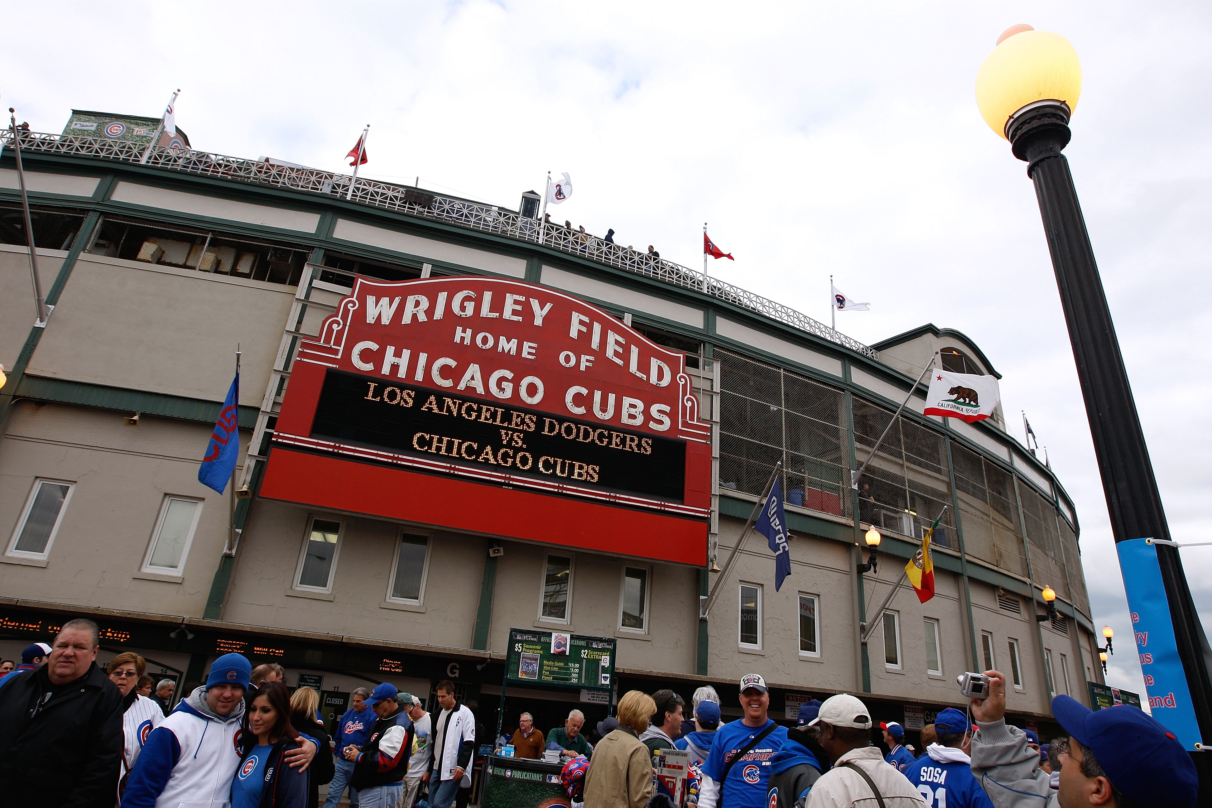 CHICAGO - OCTOBER 01:  Fans stand outside Wrigley Field under the famous marquee, which reads Los Angeles Dodgers vs. Chicago Cubs' prior to the Cubs hosting the Dodgers in Game One of the NLDS during the 2008 MLB Playoffs at Wrigley Field on October 1, 2