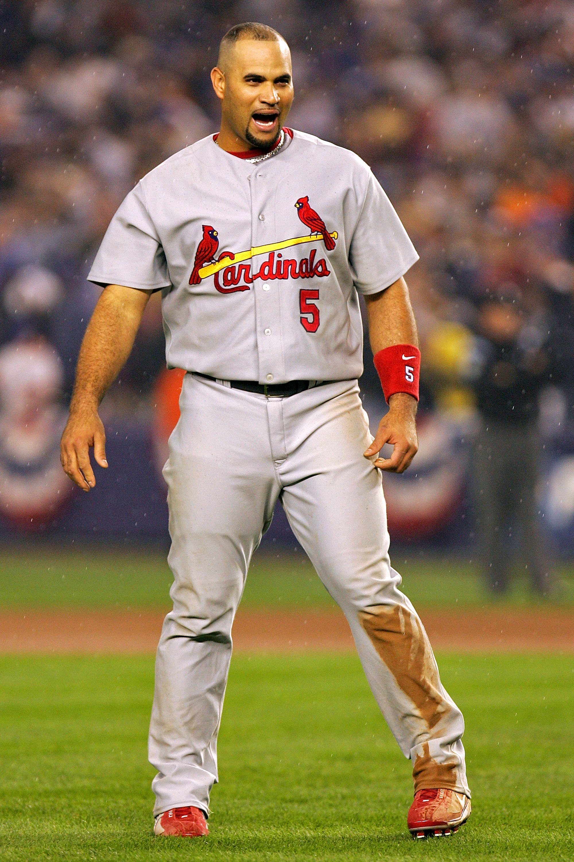 NEW YORK - OCTOBER 19:  Albert Pujols #5 of the St. Louis Cardinals reacts to flying out with the bases loaded to end the fifth inning against New York Mets during game seven of the NLCS at Shea Stadium on October 19, 2006 in the Flushing neighborhood of