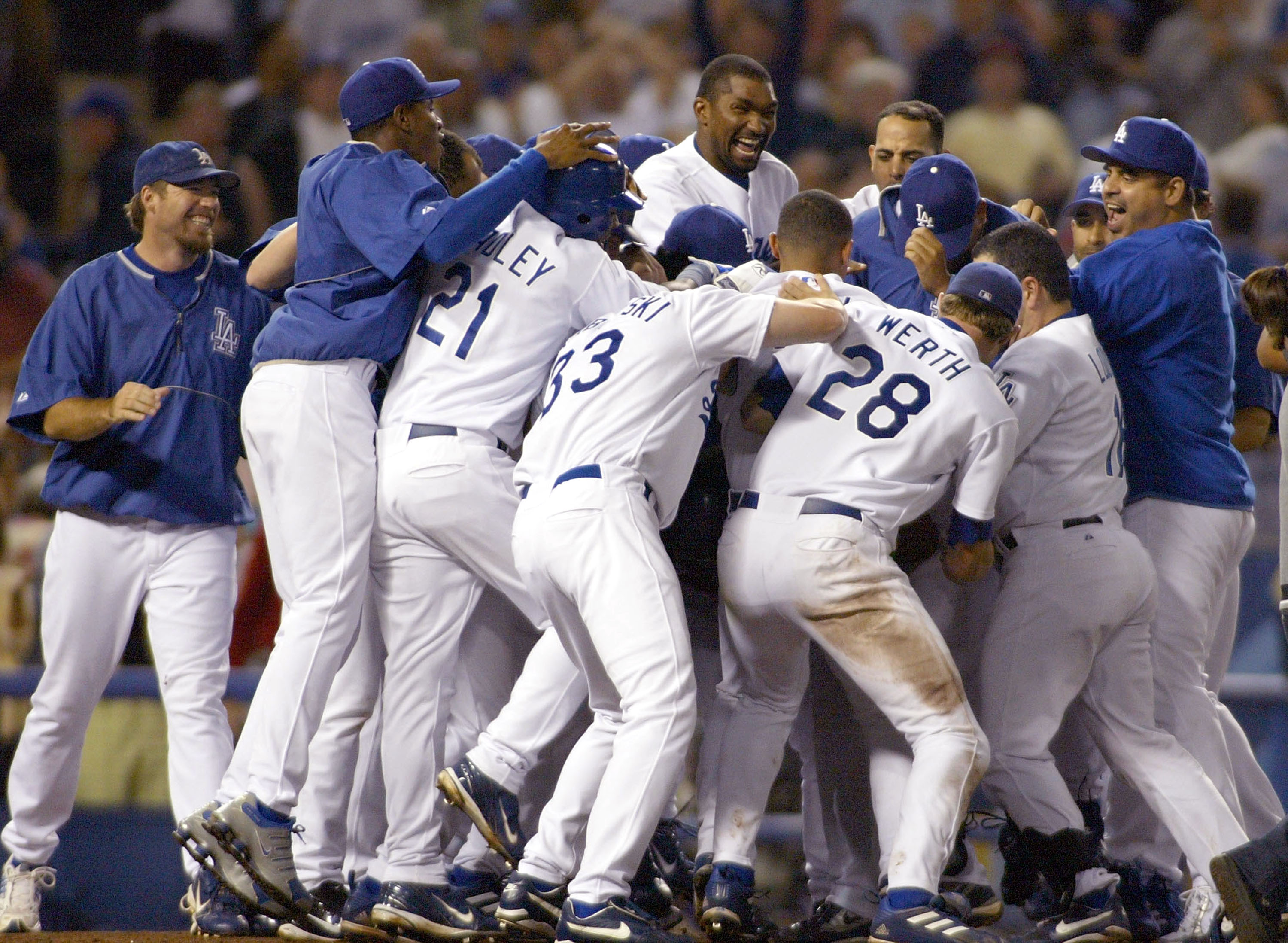 LOS ANGELES - JULY 23:  The Dodgers celebrate defeating the San Diego Padres, after the game winning home run was hit by Adrian Beltre #29 of the Los Angeles Dodgers in the ninth inning, on July 23, 2004 at Dodger Stadium in Los Angeles, California.  (Pho