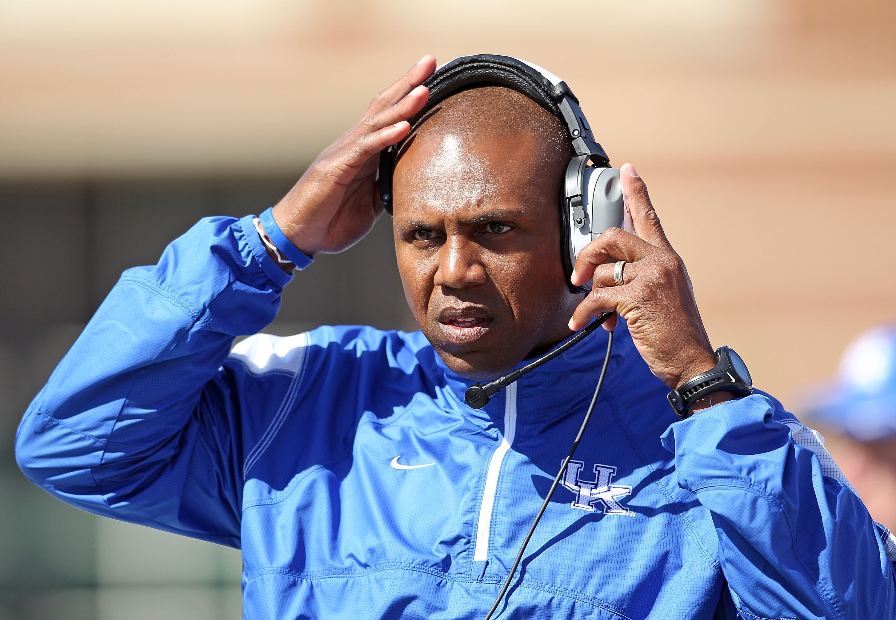 LOUISVILLE, KY - SEPTEMBER 04:  Joker Phillips the Head Coach of the Kentucky Wildcats gives instructions to his team during the game against the Louisville Cardinals at Papa John's Cardinal Stadium on September 4, 2010 in Louisville, Kentucky.  (Photo by