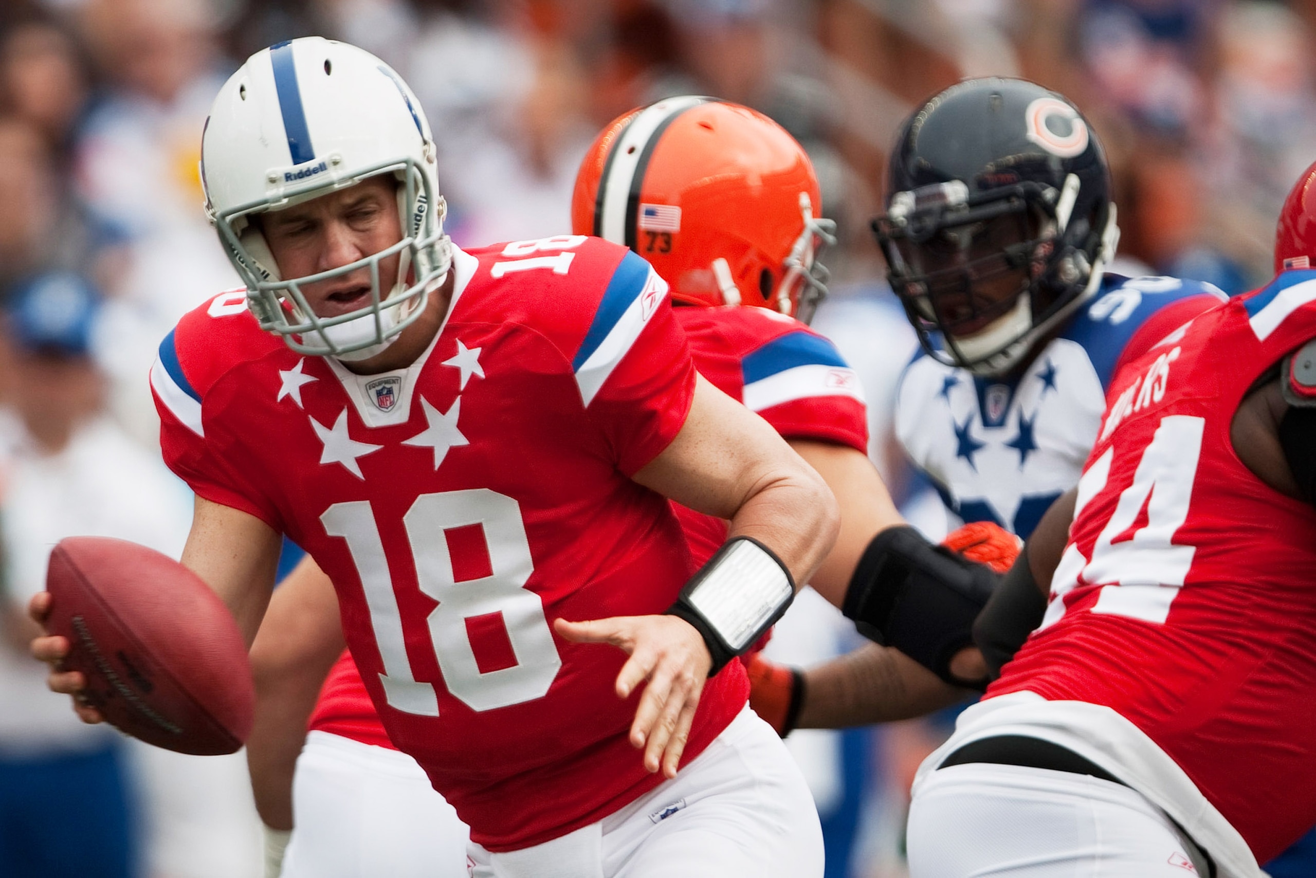 HONOLULU - JANUARY 30:  Peyton Manning, #18 of the Indianapolis Colts, carries the ball during the 2011 NFL Pro Bowl at Aloha Stadium on January 30, 2011 in Honolulu, Hawaii.  NFC won 55-41 over the AFC. (Photo by Kent Nishimura/Getty Images)
