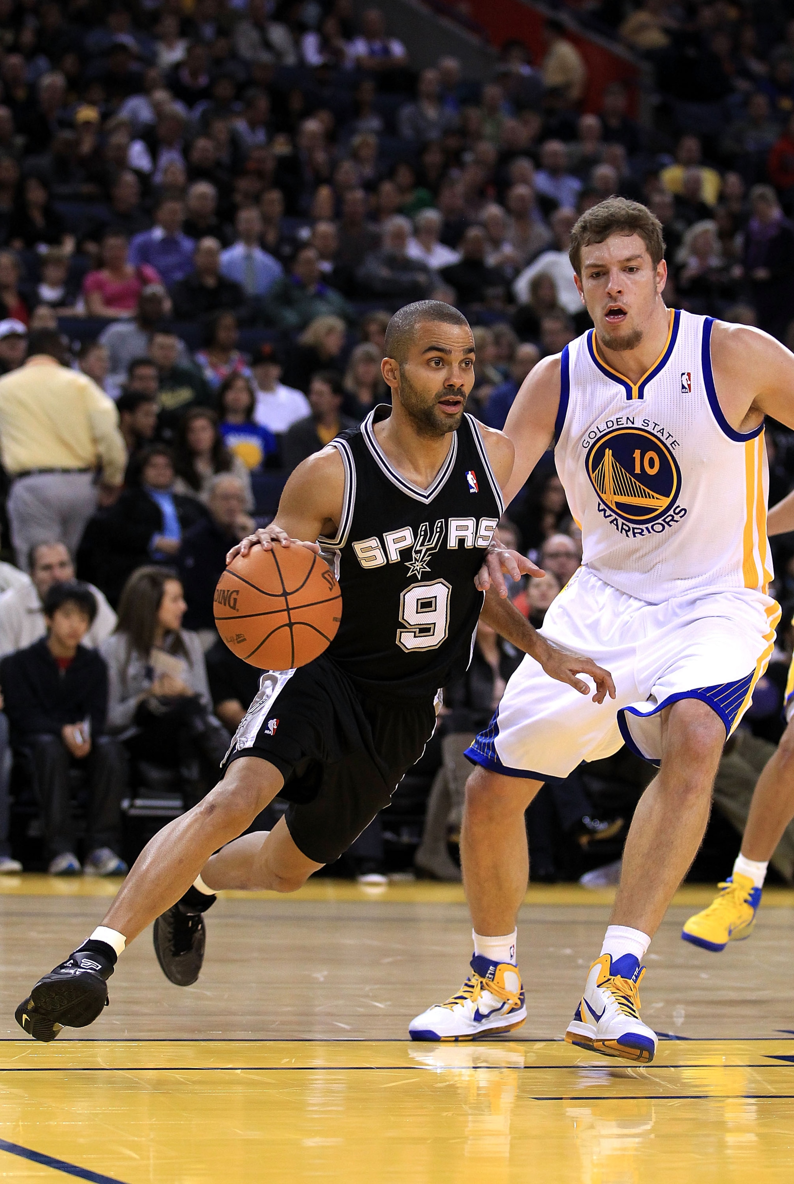 OAKLAND, CA - JANUARY 24:  Tony Parker #9 of the San Antonio Spurs in action against the Golden State Warriors at Oracle Arena on January 24, 2011 in Oakland, California.  NOTE TO USER: User expressly acknowledges and agrees that, by downloading and or us