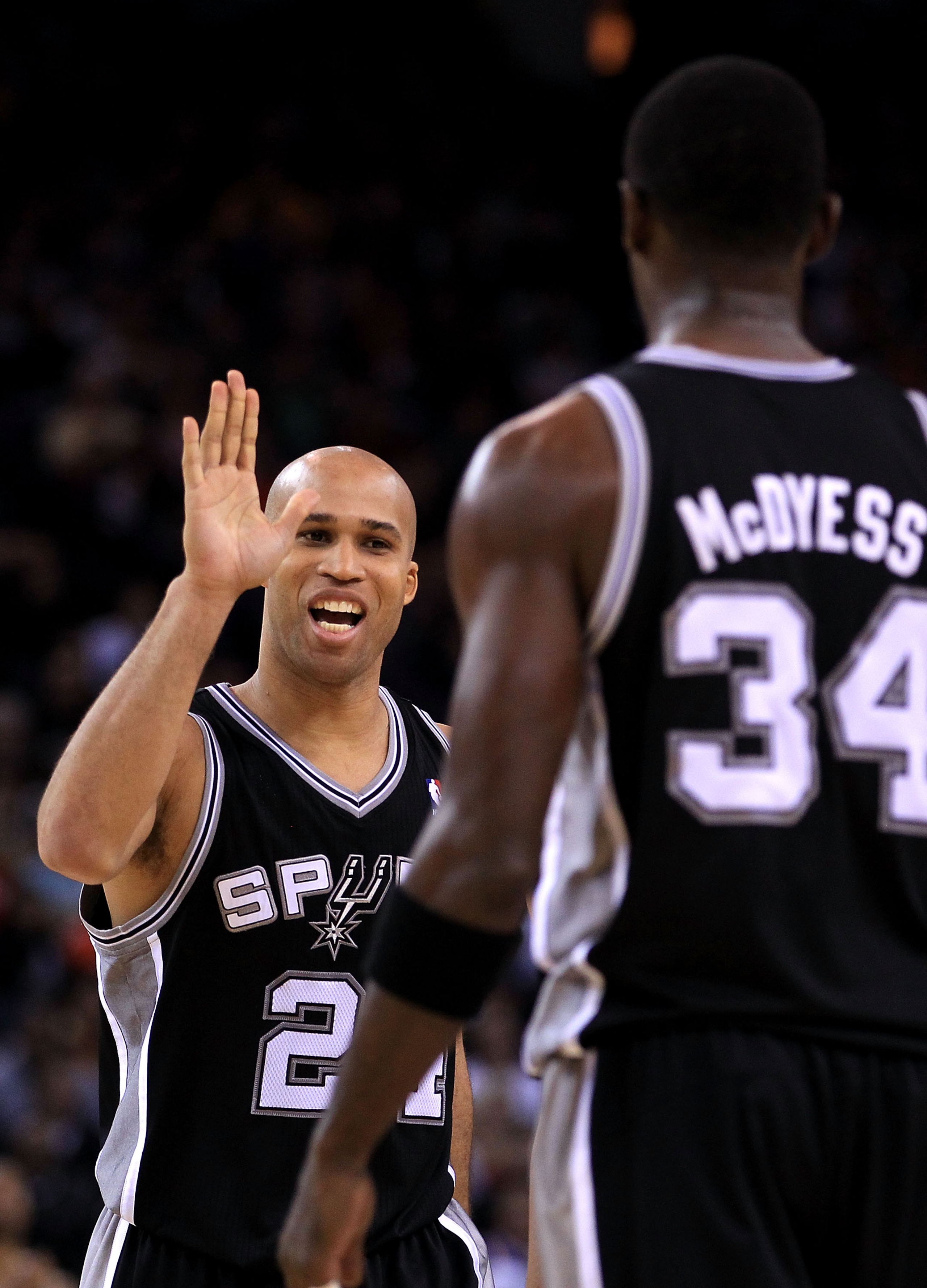 OAKLAND, CA - JANUARY 24:  Richard Jefferson #24 of the San Antonio Spurs congratulates Antonio McDyess #34 during their game against the Golden State Warriors at Oracle Arena on January 24, 2011 in Oakland, California.  NOTE TO USER: User expressly ackno