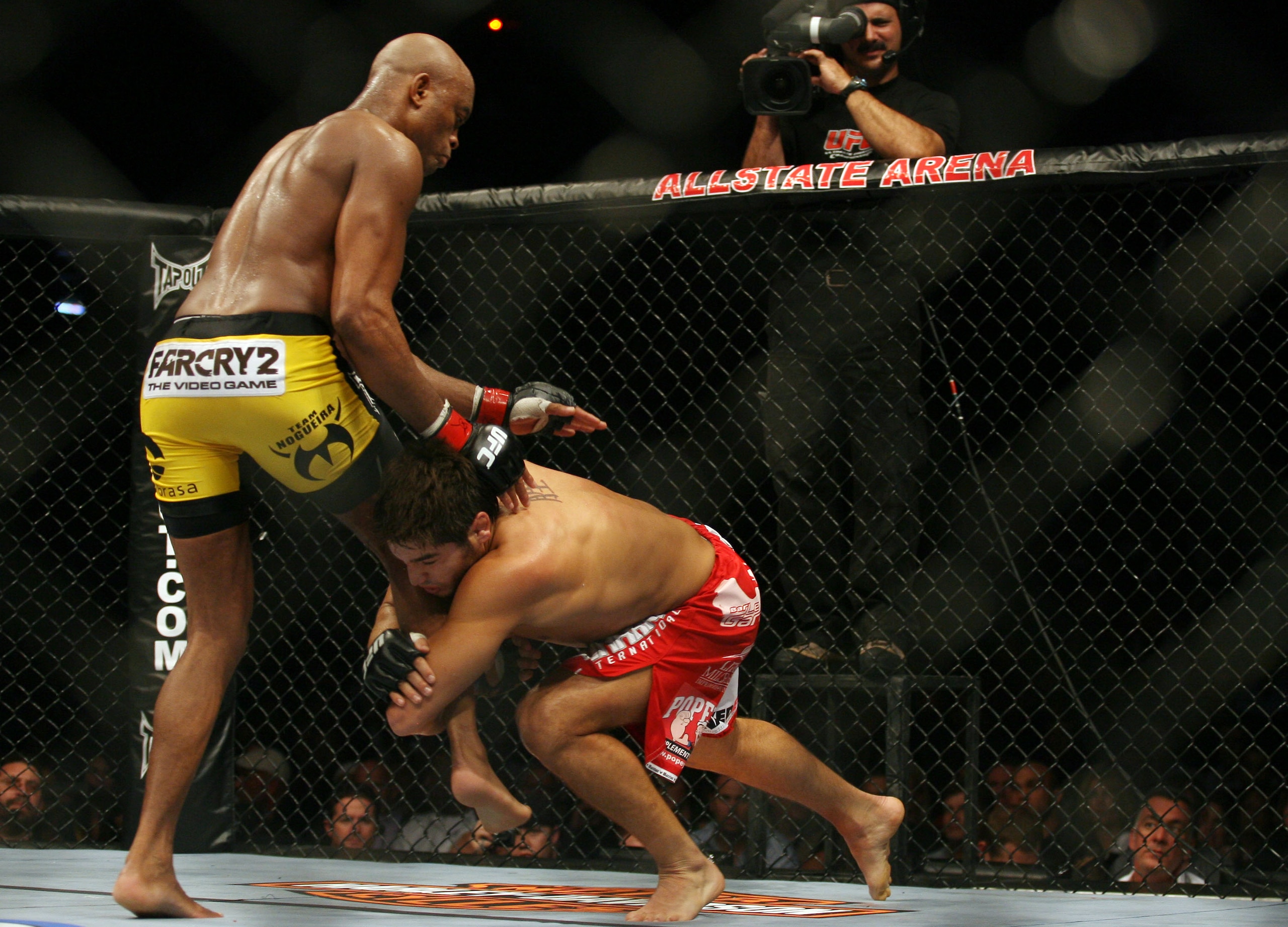CHICAGO- OCTOBER 25: Anderson Silva (L) wrestles with Patrick Cote in the Middleweight Title Bout at UFC's Ultimate Fight Night at Allstate Arena on October 25, 2008 in Chicago, Illinois. (Photo by Tasos Katopodis/Getty Images) CHICAGO- OCTOBER 25: Anderson Silva (L) wrestles with Patrick Cote in the Middleweight Title Bout at UFC's Ultimate Fight Night at Allstate Arena on October 25, 2008 in Chicago, Illinois. (Photo by Tasos Katopodis/Getty Images)