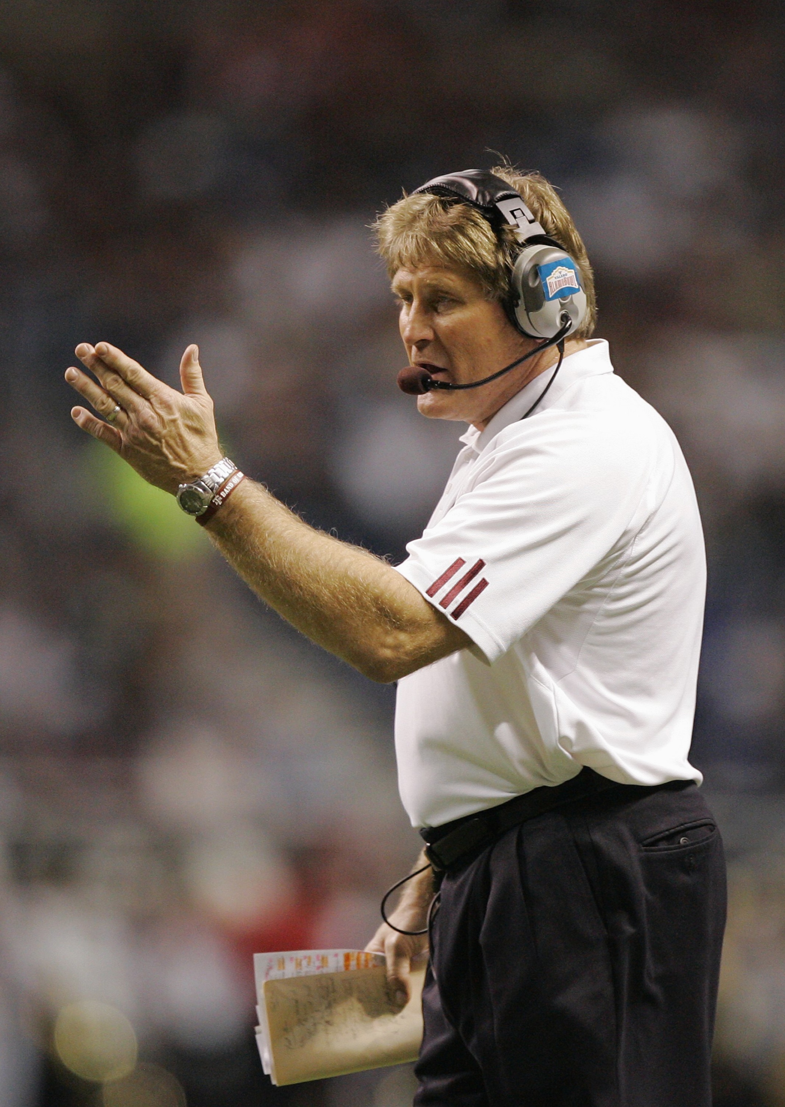 SAN ANTONIO - DECEMBER 29:  Interim Head Coach Gary Darnell of the Texas A&M Aggies calls a play from the sideline against the Penn State Nittany Lions during the Valero Alamo Bowl on December 29, 2007 at the Alamodome in San Antonio, Texas.  Penn State w