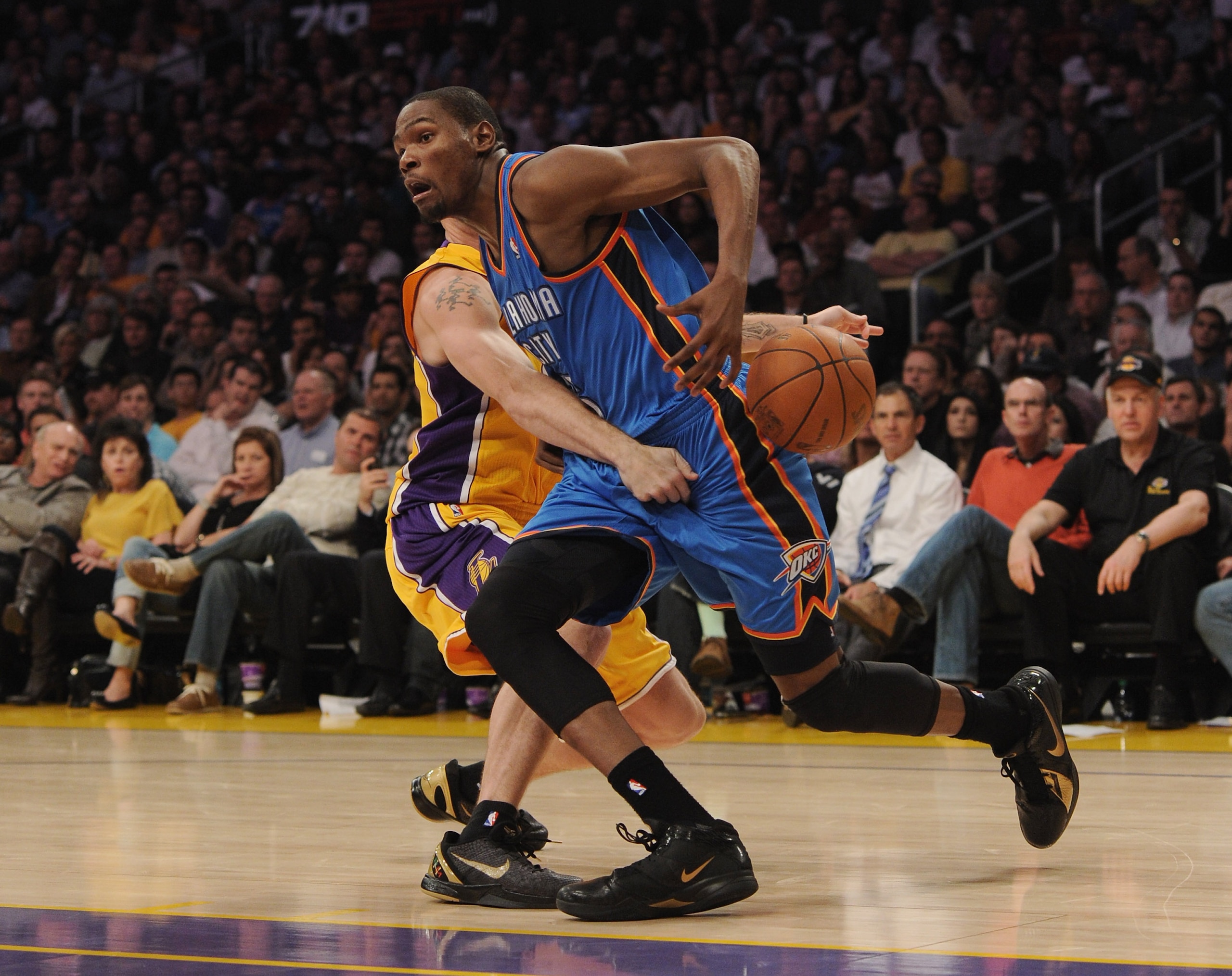 LOS ANGELES, CA - JANUARY 17:  Kevin Durant #35 of the Oklahoma City Thunder has the ball knocked away by Luke Walton #4 of the Los Angeles Lakers at the Staples Center on January 17, 2011 in Los Angeles, California.   NOTE TO USER: User expressly acknowl