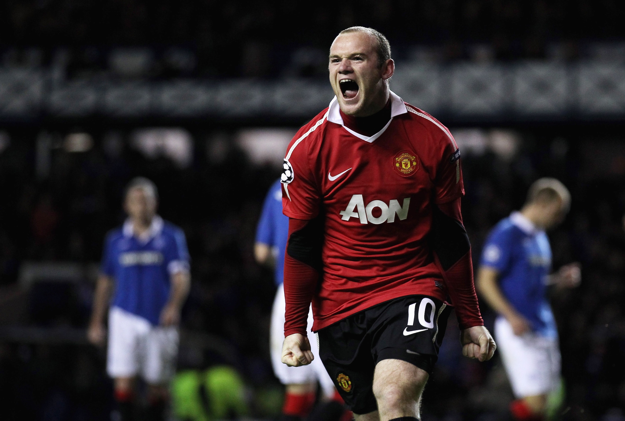 GLASGOW, SCOTLAND - NOVEMBER 24:  Wayne Rooney of Manchester United celebrates after scoring the winning goal from the penalty spot during the UEFA Champions League Group C match between Glasgow Rangers and Manchester United at Ibrox on November 24, 2010