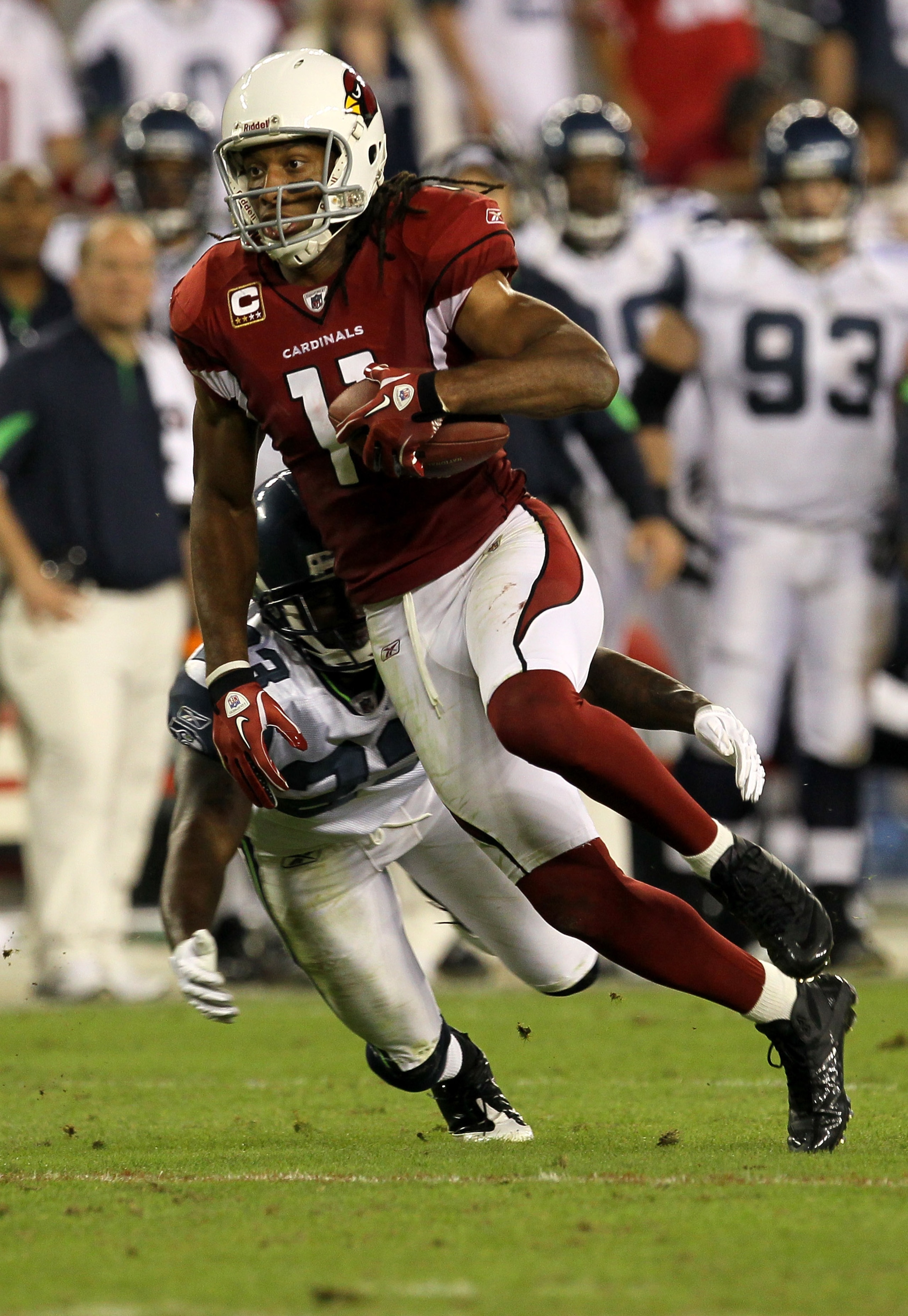 GLENDALE, AZ - NOVEMBER 14:  Wide receiver Larry Fitzgerald #11 of the Arizona Cardinals carries the ball against the Seattle Seahawks at University of Phoenix Stadium on November 14, 2010 in Glendale, Arizona. Seattle won 36-18.  (Photo by Stephen Dunn/G