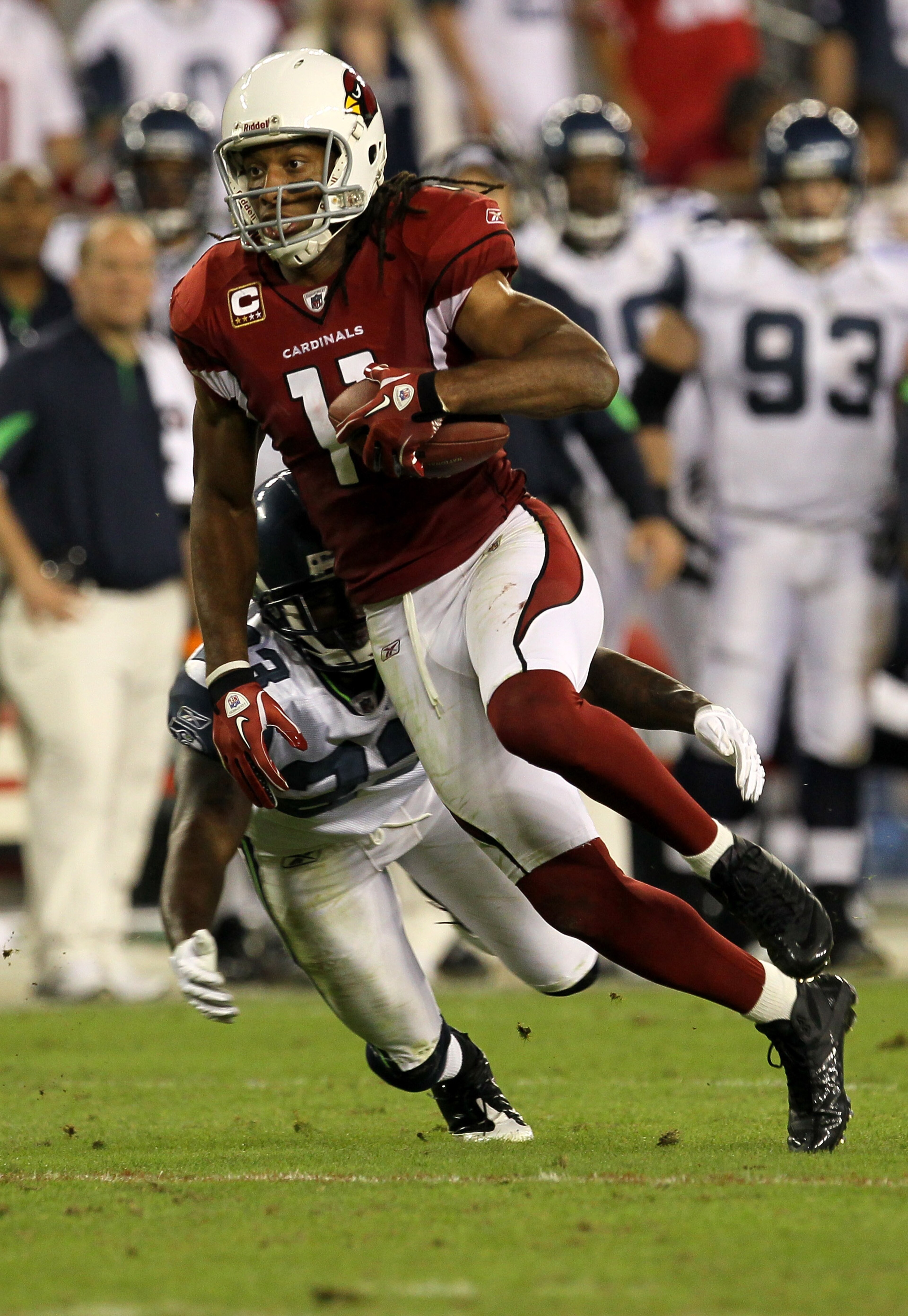 GLENDALE, AZ - NOVEMBER 14:  Wide receiver Larry Fitzgerald #11 of the Arizona Cardinals carries the ball against the Seattle Seahawks at University of Phoenix Stadium on November 14, 2010 in Glendale, Arizona. Seattle won 36-18.  (Photo by Stephen Dunn/G