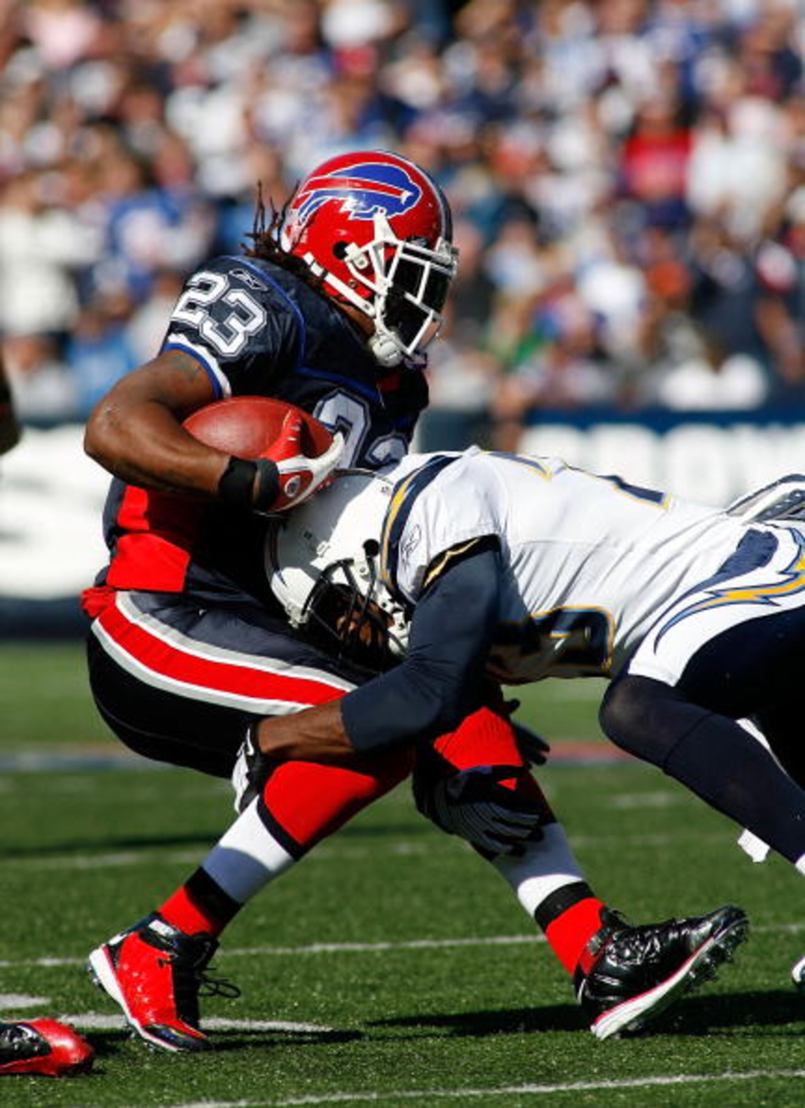 ORCHARD PARK, NY - OCTOBER 19: Marshawn Lynch #23 of the Buffalo Bills is tackled by Quentin Jammer #23 of the San Diego Chargers on October 19, 2008 at Ralph Wilson Stadium in Orchard Park, New York. Buffalo won 23-14. (Photo by Rick Stewart/Getty Imag ORCHARD PARK, NY - OCTOBER 19: Marshawn Lynch #23 of the Buffalo Bills is tackled by Quentin Jammer #23 of the San Diego Chargers on October 19, 2008 at Ralph Wilson Stadium in Orchard Park, New York. Buffalo won 23-14. (Photo by Rick Stewart/Getty Imag