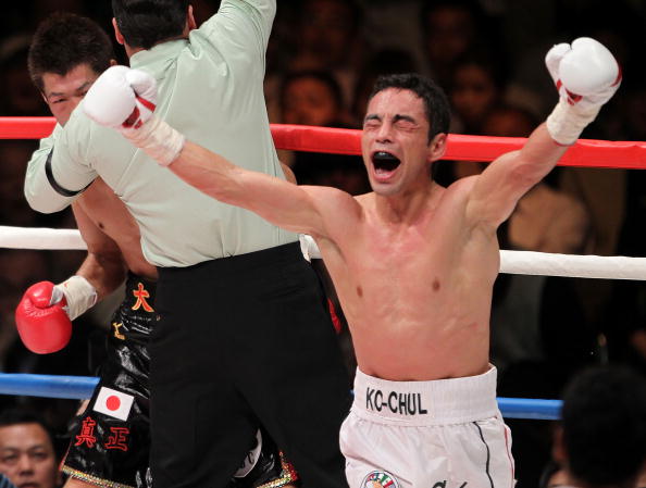 TOKYO - APRIL 30:  Fernando Montiel of Mexico celebrates after knocking out Hozumi Hasegawa of Japan during the WBC Bantamweight Title Fight between Hozumi Hasegawa and Fernando Montiel at Nippon Budokan on April 30, 2010 in Tokyo, Japan.  (Photo by Koich