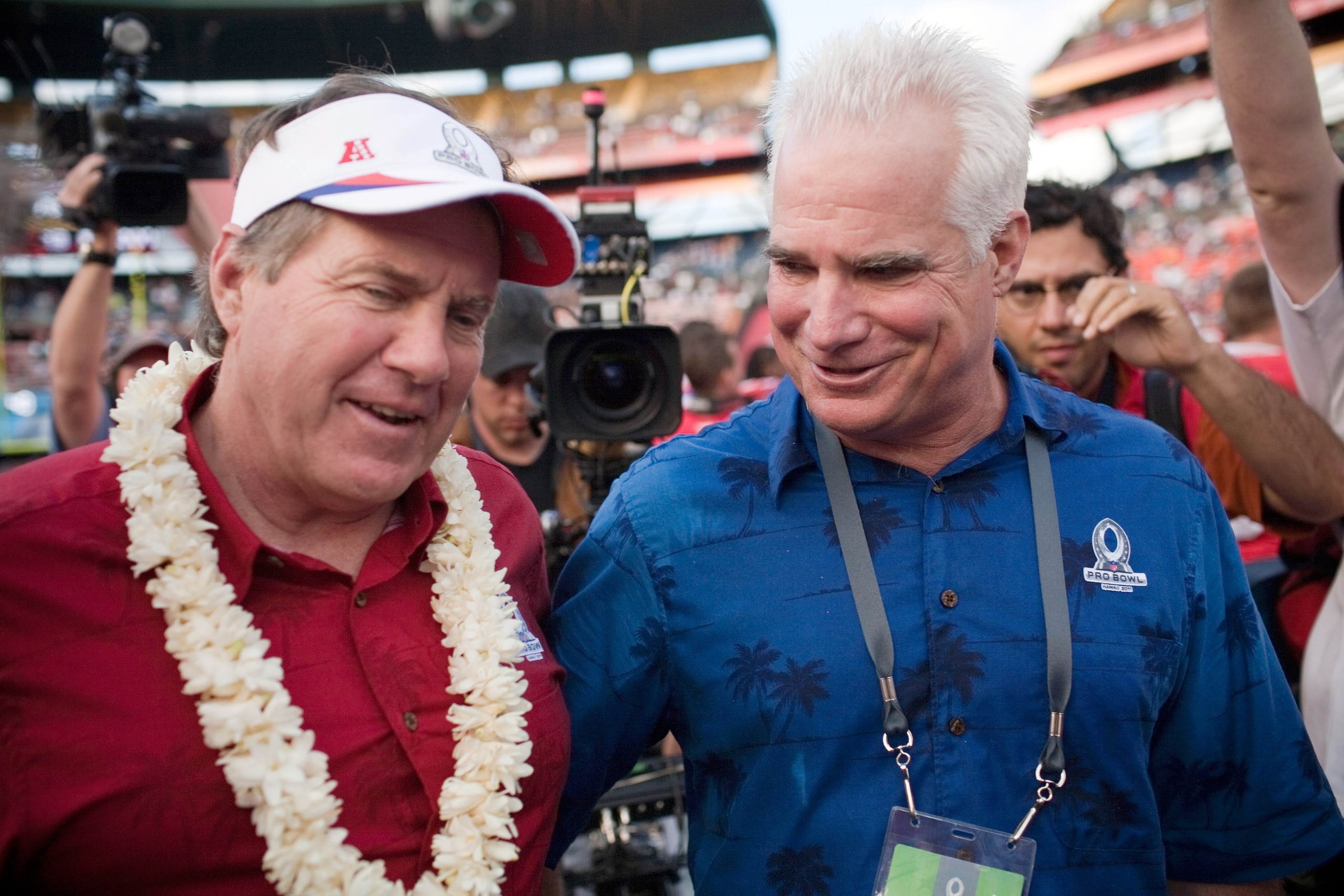 HONOLULU - JANUARY 30: Bill Belichick (L) Head Coach of the American Football Conference team, and Michael Smith, Head Coach of the National Football Conference team greet each other at the end of the 2011 NFL Pro Bowl at Aloha Stadium on January 30, 201 HONOLULU - JANUARY 30: Bill Belichick (L) Head Coach of the American Football Conference team, and Michael Smith, Head Coach of the National Football Conference team greet each other at the end of the 2011 NFL Pro Bowl at Aloha Stadium on January 30, 201