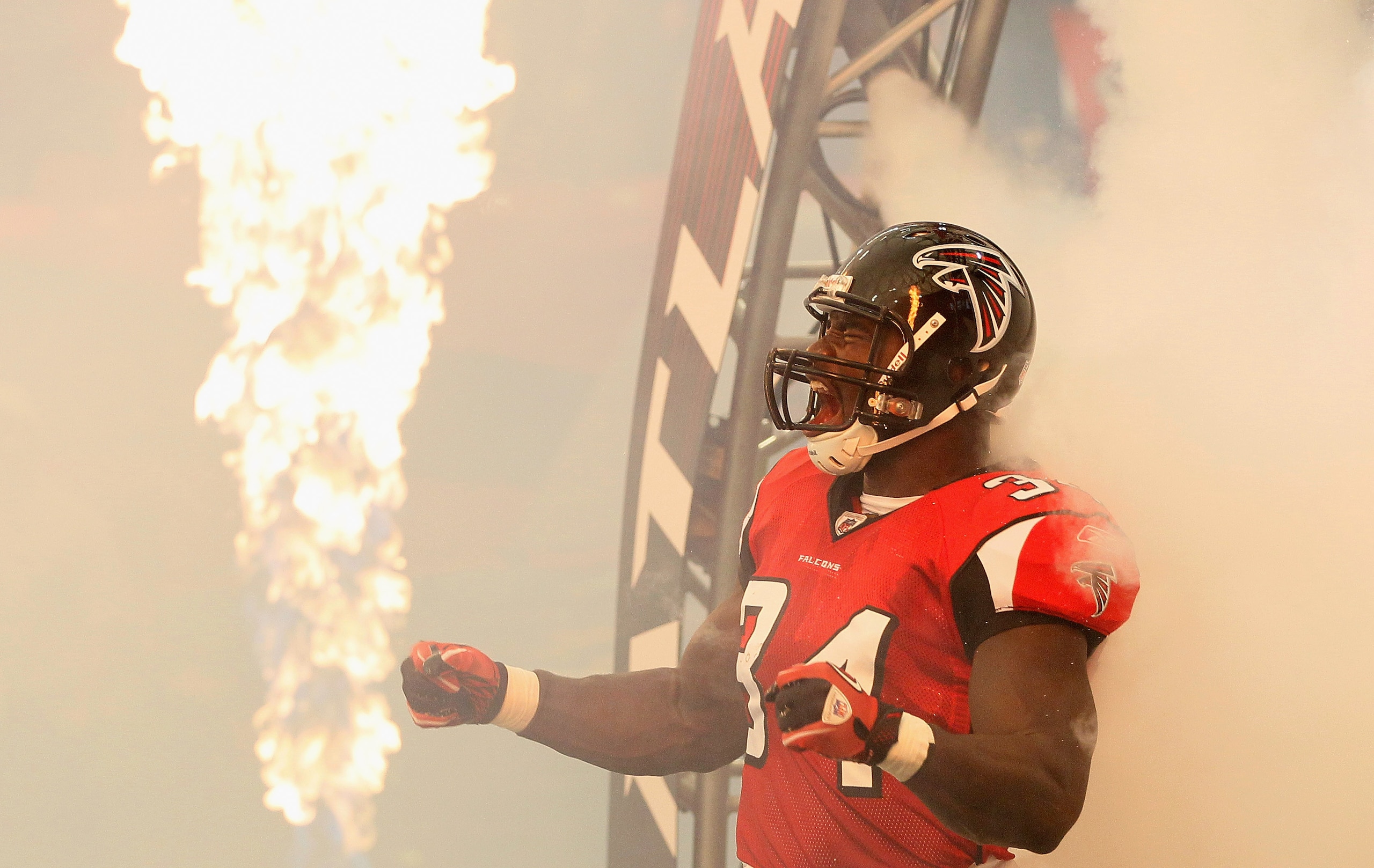 ATLANTA - SEPTEMBER 19:  Ovie Mughelli #34 of the Atlanta Falcons enters the field to face the Arizona Cardinals at Georgia Dome on September 19, 2010 in Atlanta, Georgia.  (Photo by Kevin C. Cox/Getty Images)