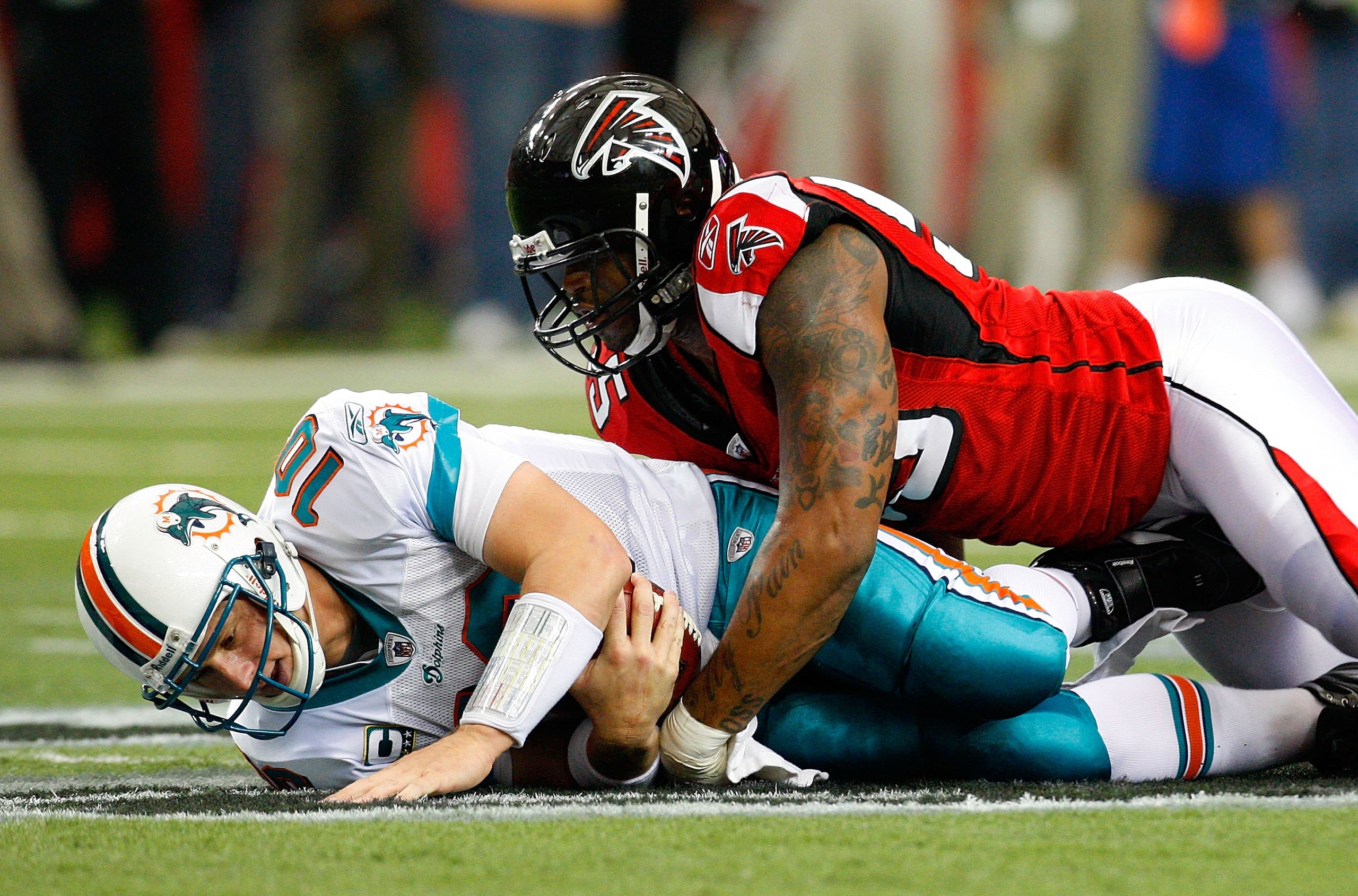 ATLANTA - SEPTEMBER 13:  John Abraham #55 of the Atlanta Falcons sacks quarterback Chad Pennington #10 of the Miami Dolphins at Georgia Dome on September 13, 2009 in Atlanta, Georgia.  (Photo by Kevin C. Cox/Getty Images)