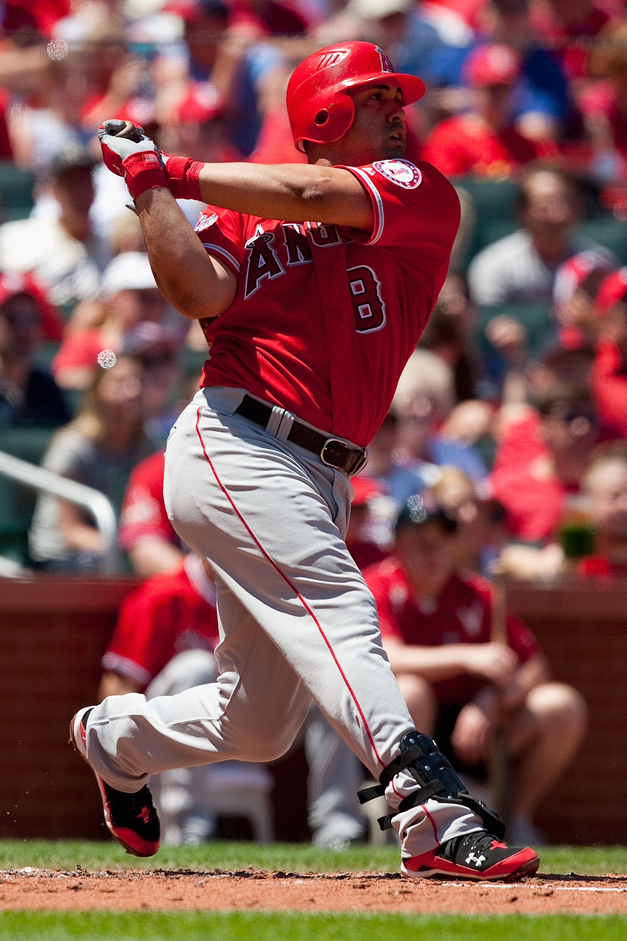 ST. LOUIS - MAY 22: Kendry Morales #8 of the Los Angeles Angels of Anaheim hits an RBI double against the St. Louis Cardinals at Busch Stadium on May 22, 2010 in St. Louis, Missouri.  The Angels beat the Cardinals 10-7.  (Photo by Dilip Vishwanat/Getty Im