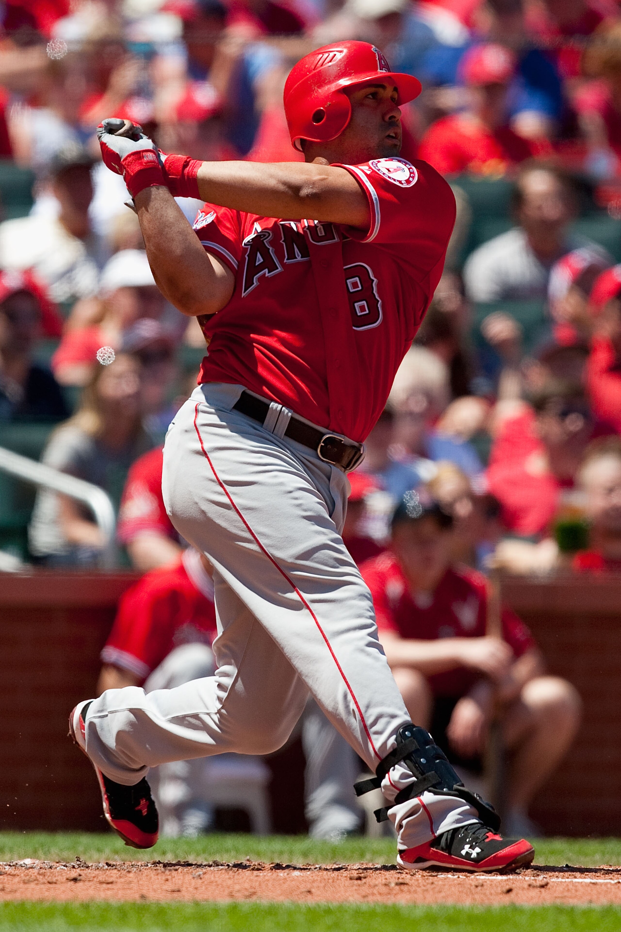 ST. LOUIS - MAY 22: Kendry Morales #8 of the Los Angeles Angels of Anaheim hits an RBI double against the St. Louis Cardinals at Busch Stadium on May 22, 2010 in St. Louis, Missouri.  The Angels beat the Cardinals 10-7.  (Photo by Dilip Vishwanat/Getty Im