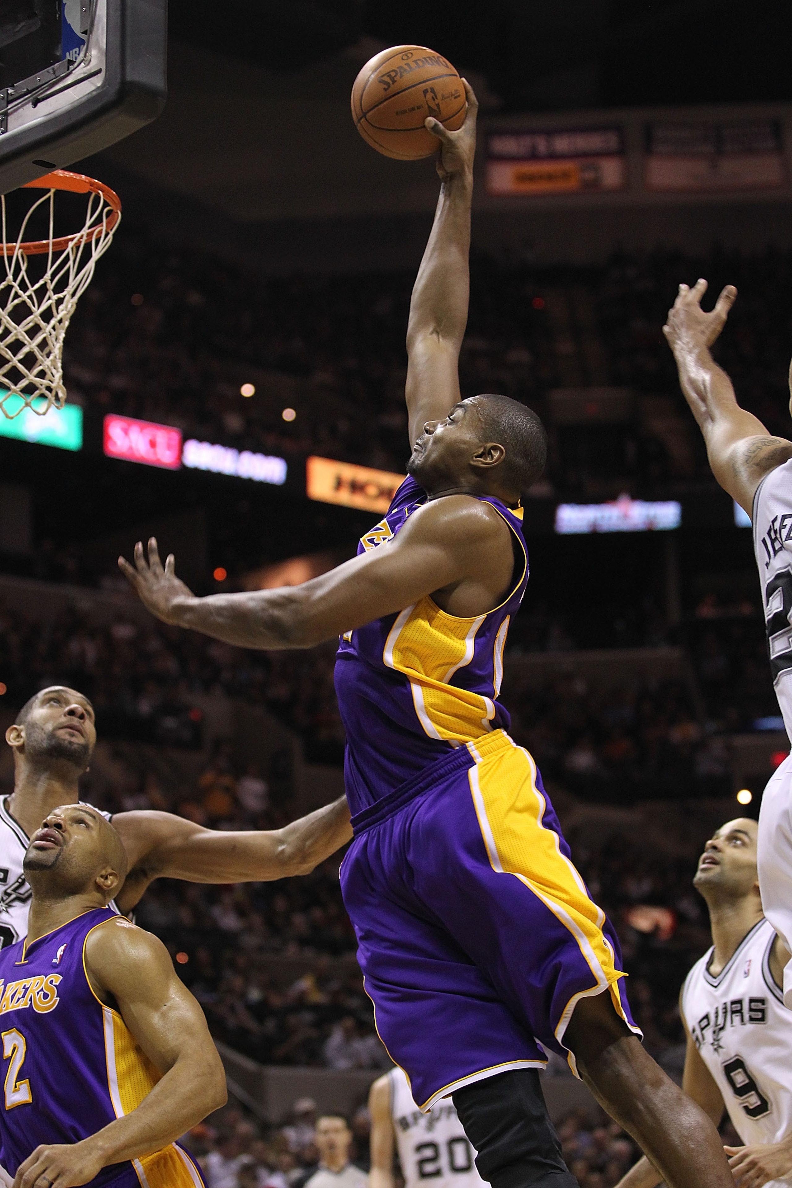 SAN ANTONIO, TX - DECEMBER 28:  Center Andrew Bynum #17 of the Los Angeles Lakers slams the ball against the San Antonio Spurs at AT&T Center on December 28, 2010 in San Antonio, Texas.  NOTE TO USER: User expressly acknowledges and agrees that, by downlo