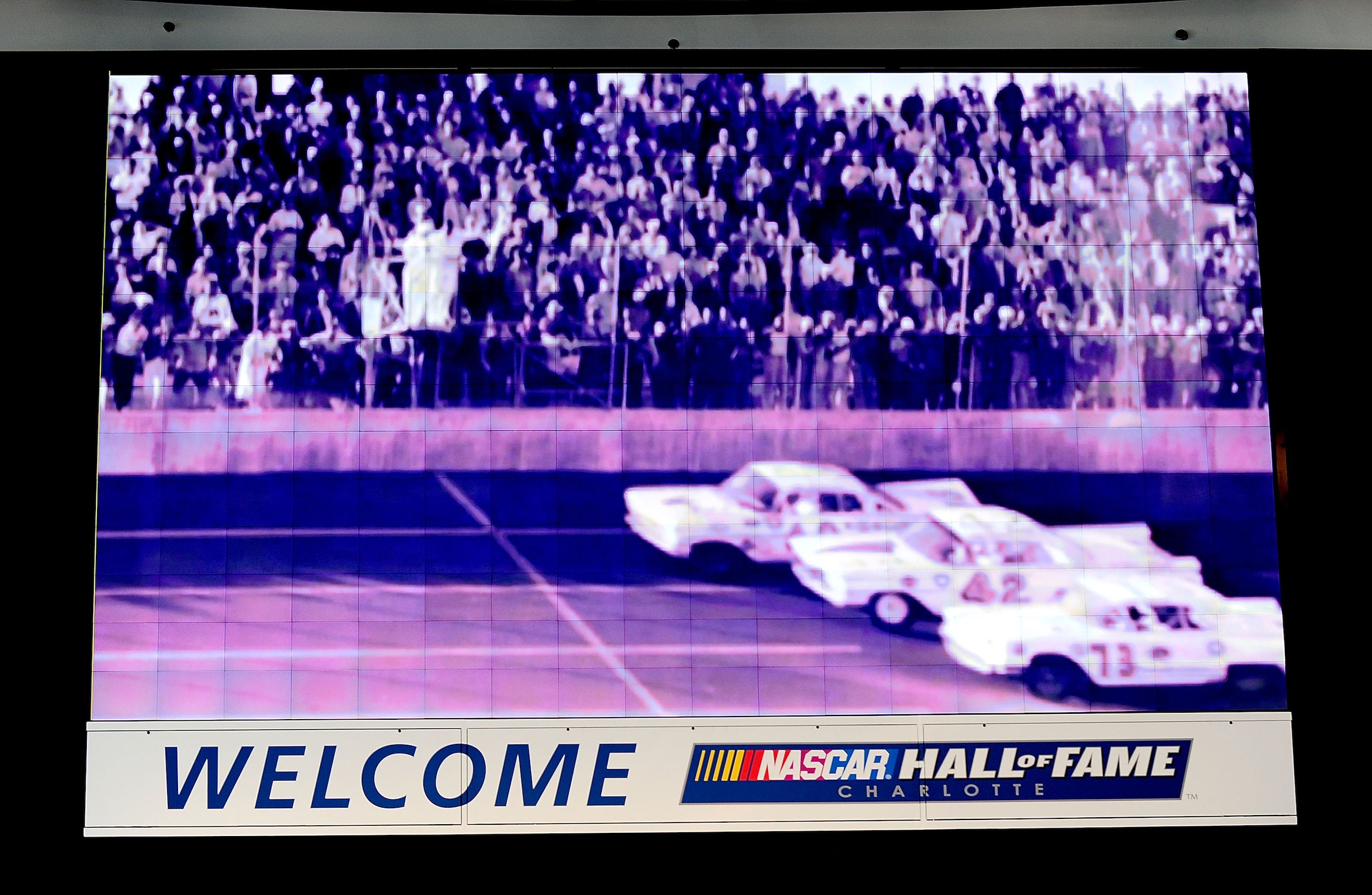 CHARLOTTE, NC - OCTOBER 13:   An image of the finish of the first Daytona 500 showing Lee Petty as the winner is shown on the jumbotron during NASCAR Hall of Fame Voting Day at the NASCAR Hall of Fame on October 13, 2010 in Charlotte, North Carolina.  (Ph