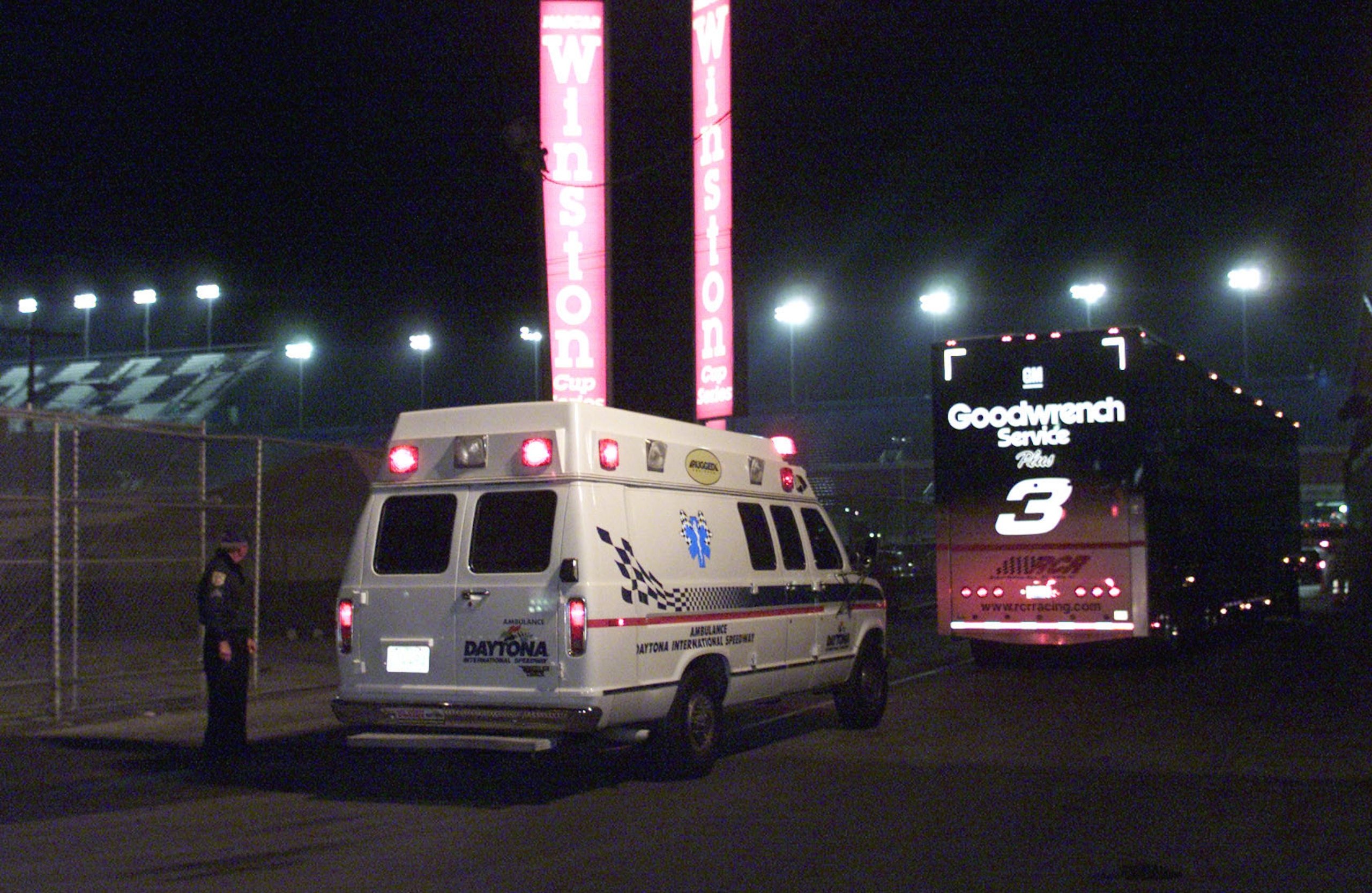 385743 03: Dale Earnhardt's car hauler leaves the Daytona International Speedway track followed by an ambulance February 18, 2001 in Daytona Beach, Florida. Earnhardt died earlier in the day from injuries sustained in a crash on the last lap of the Dayton