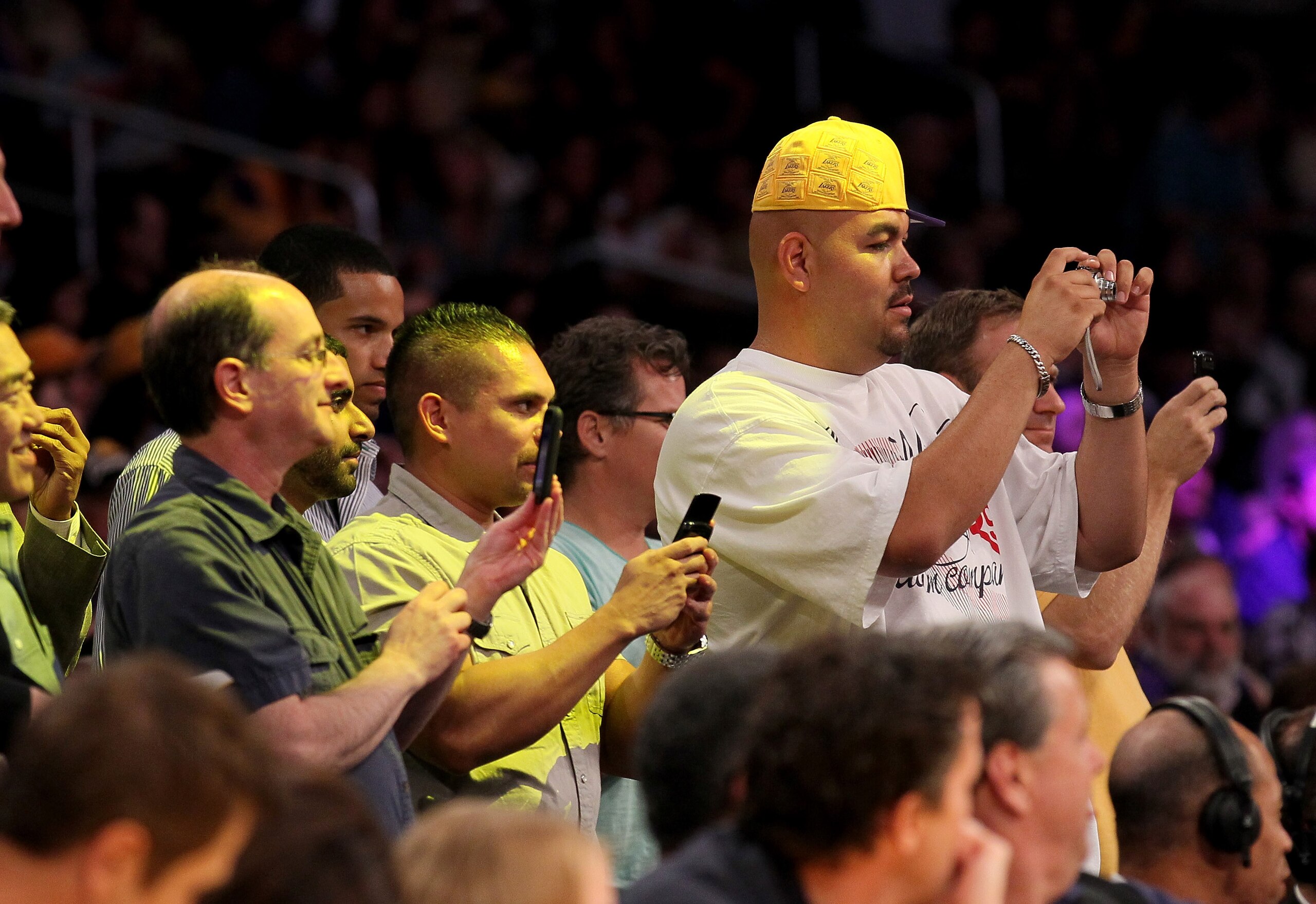 LOS ANGELES - NOVEMBER 5: Laker fans take some snapshots during the game between the Toronto Raptors andthe Los Angeles Lakers at Staples Center on November 5, 2010 in Los Angeles, California.   NOTE TO USER: User expressly acknowledges and agrees that, b