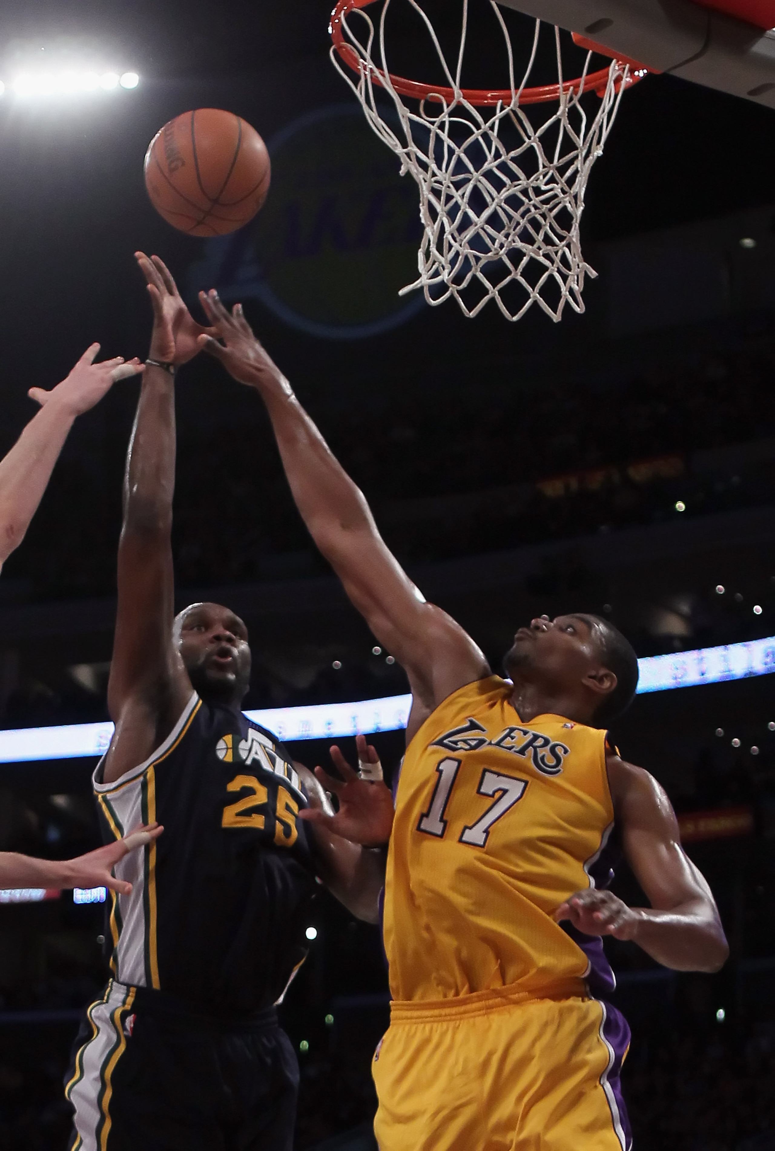 LOS ANGELES, CA - JANUARY 25:  Al Jefferson #25 of the Utah Jazz drives to the basket past Andrew Bynum #17 of the Los Angeles Lakers in the first half at Staples Center on January 25, 2011 in Los Angeles, California. NOTE TO USER: User expressly acknowle