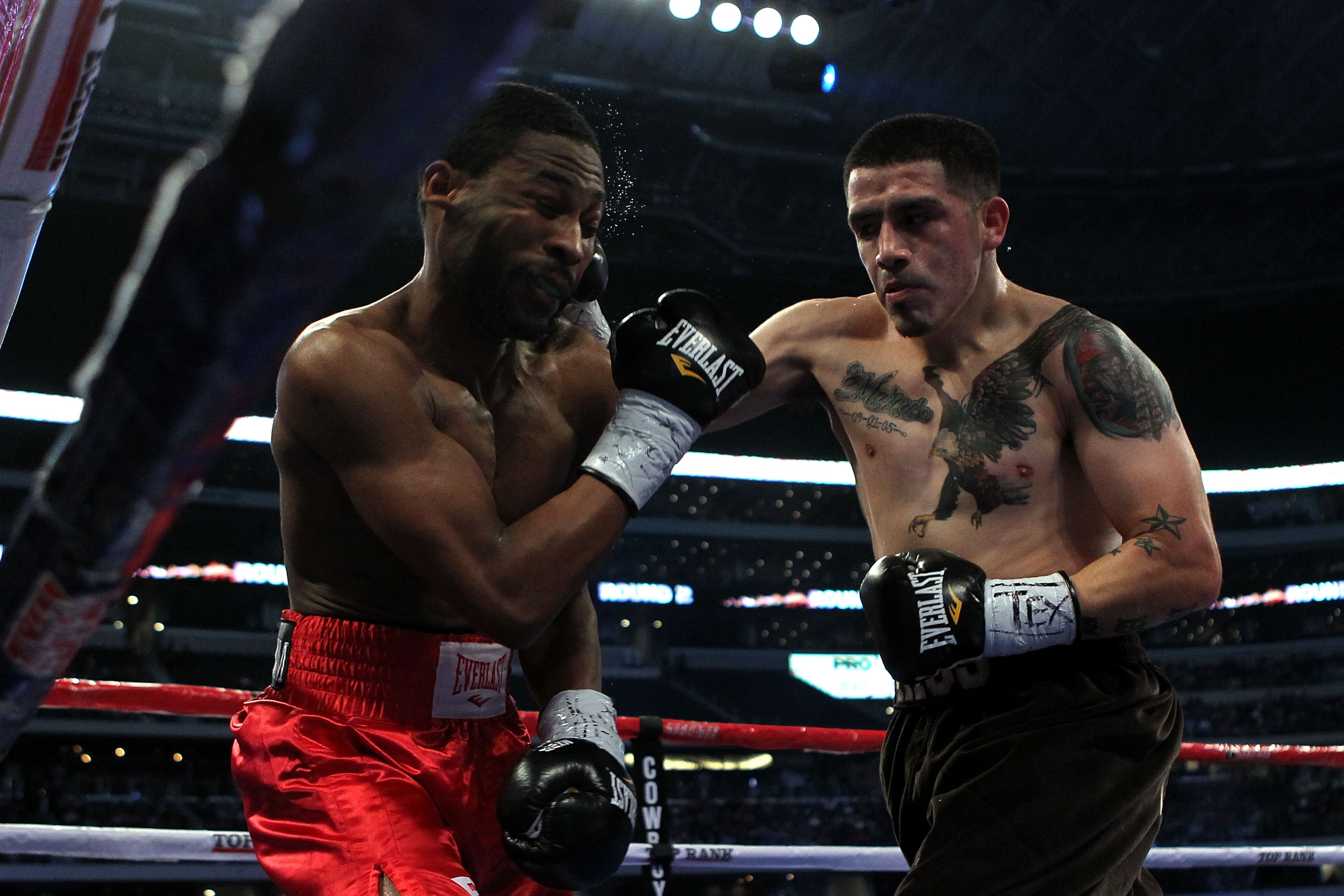 ARLINGTON, TX - NOVEMBER 13: Brandon Rios (R in brown trunks) lands a punch against Omri Lowther (red trunks) during their Super Lightweight bout at Cowboys Stadium on November 13, 2010 in Arlington, Texas. (Photo by Nick Laham/Getty Images) ARLINGTON, TX - NOVEMBER 13: Brandon Rios (R in brown trunks) lands a punch against Omri Lowther (red trunks) during their Super Lightweight bout at Cowboys Stadium on November 13, 2010 in Arlington, Texas. (Photo by Nick Laham/Getty Images)