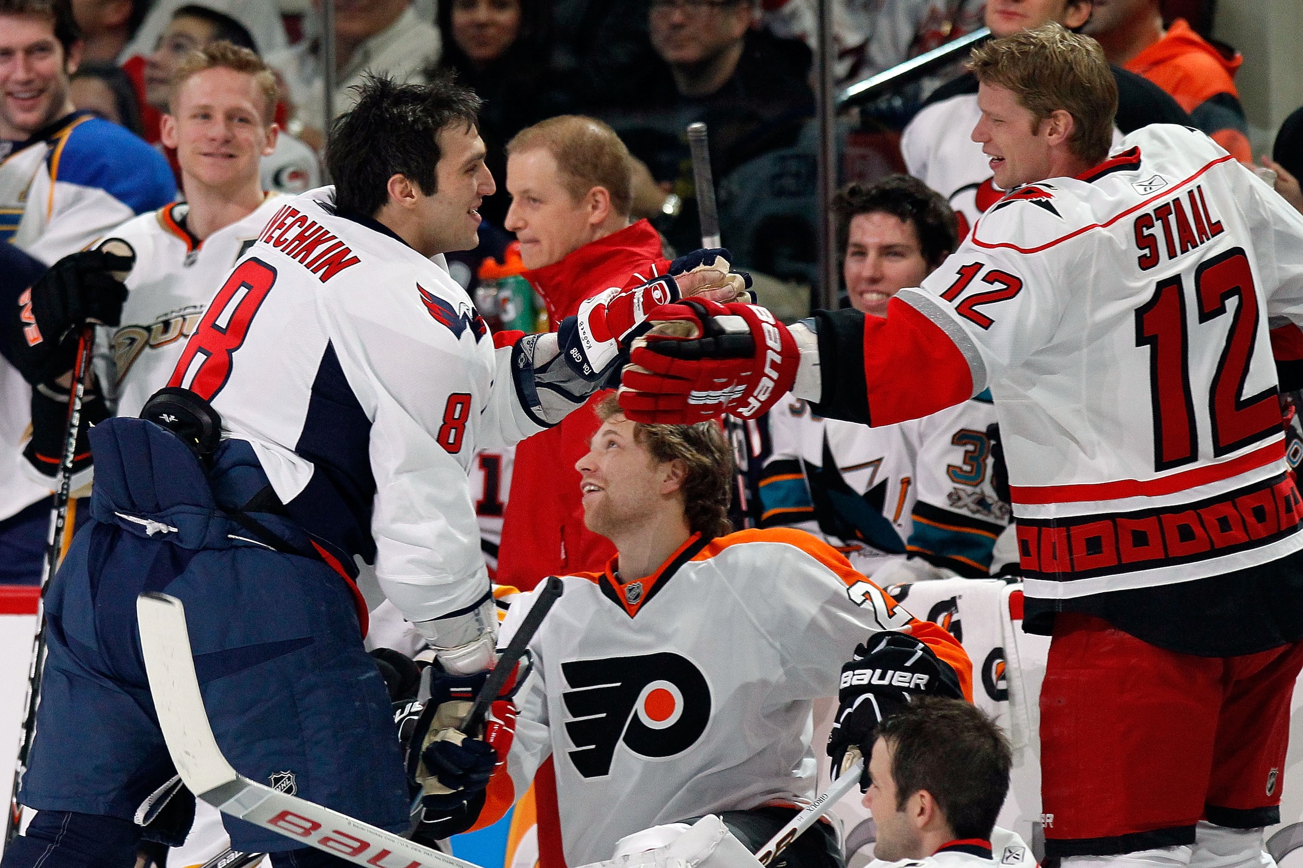 RALEIGH, NC - JANUARY 29:  Alexander Ovechkin #8 of the Washington Capitals is congratulated by Eric Staal #12 of the Carolina Hurricanes against Team Staal he wins the breakaway challenge during the Honda NHL SuperSkills competition part of 2011 NHL All-