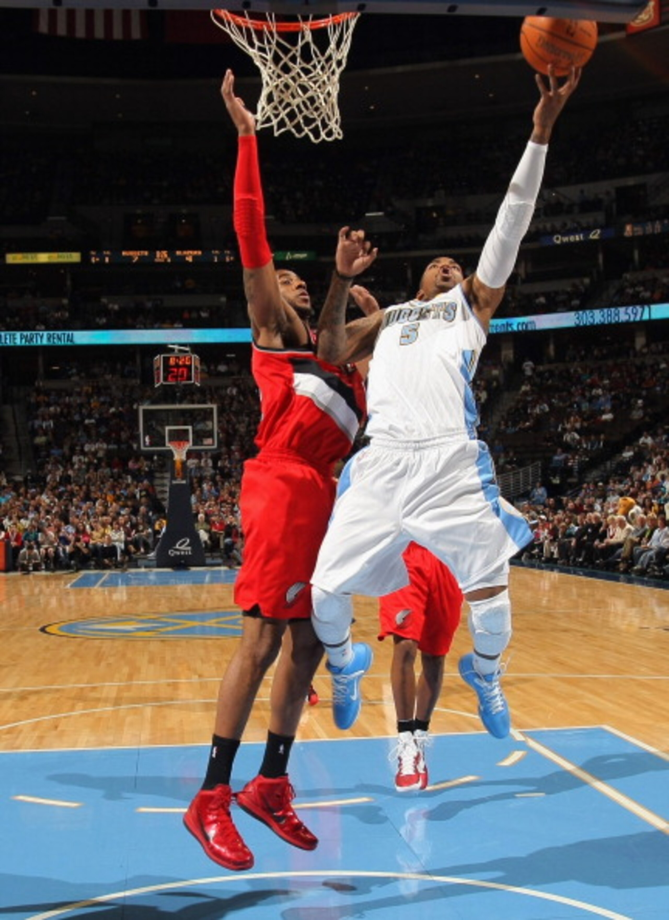 DENVER - DECEMBER 28: J.R. Smith #5 of the Denver Nuggets takes a shot against the defense of LaMarcus Aldridge #12 of the Portland Trail Blazers at Pepsi Center on December 28, 2010 in Denver, Colorado. The Nuggets defeated the Blazers 95-77. NOTE TO US DENVER - DECEMBER 28: J.R. Smith #5 of the Denver Nuggets takes a shot against the defense of LaMarcus Aldridge #12 of the Portland Trail Blazers at Pepsi Center on December 28, 2010 in Denver, Colorado. The Nuggets defeated the Blazers 95-77. NOTE TO US