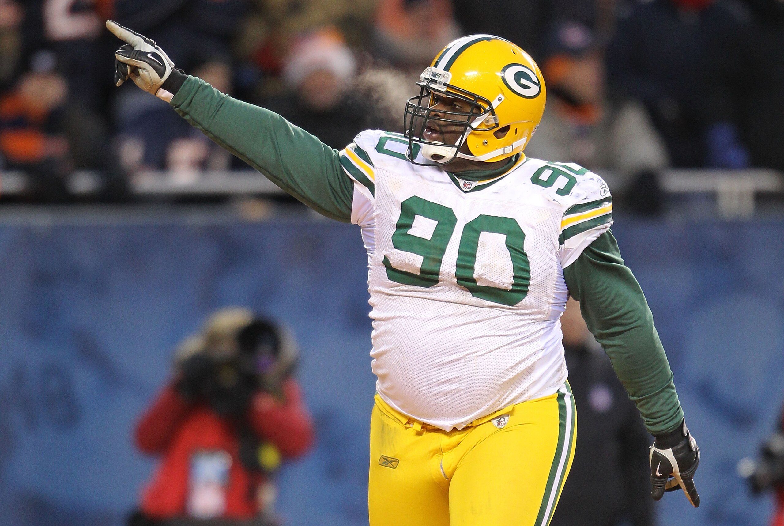 CHICAGO, IL - JANUARY 23:  B.J. Raji #90 of the Green Bay Packers reacts after scoring on a 18-yard interception return for a touchdown in the fourth quarter against the Chicago Bears in the NFC Championship Game at Soldier Field on January 23, 2011 in Ch