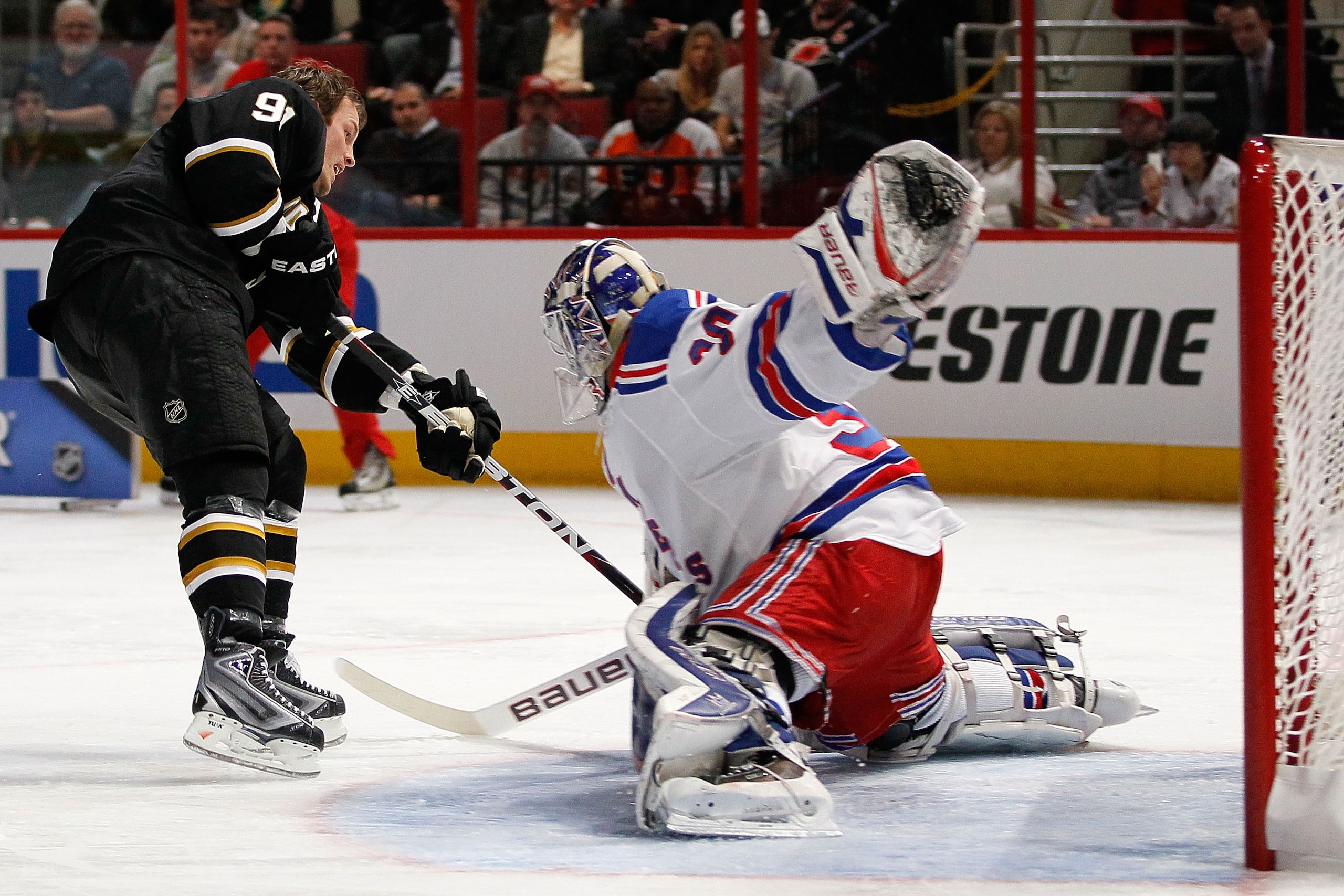RALEIGH, NC - JANUARY 29:  Brad Richards #91 of the Dallas Stars shoots on Henrik Lundqvist #30 of New York Rangers in the elimination shootout during the Honda NHL SuperSkills competition part of 2011 NHL All-Star Weekend at the RBC Center on January 29,