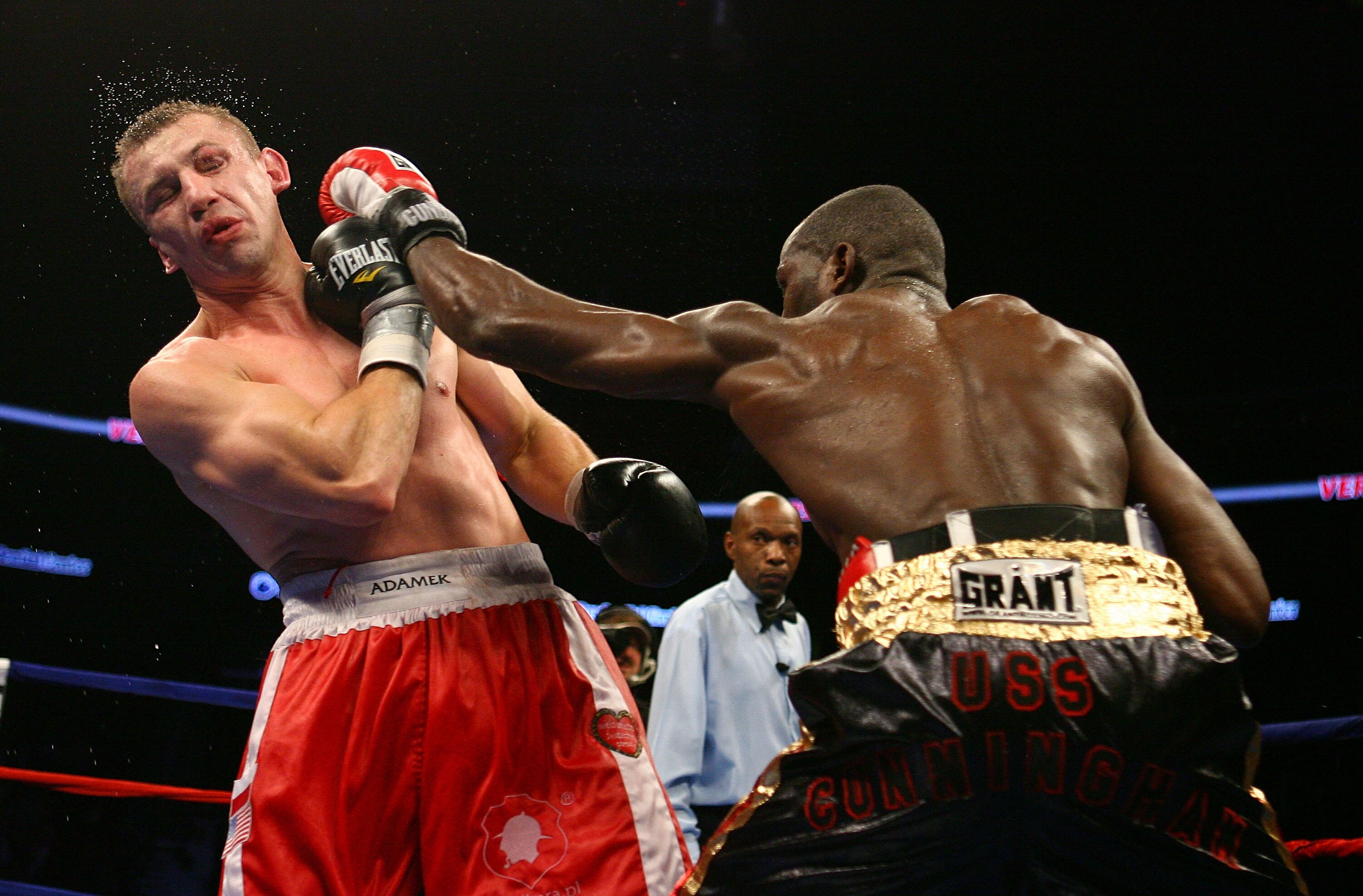 NEWARK, NJ - DECEMBER 11:  Steve Cunningham punches Tomasz Adamek during their IBF Cruiserweight Championship fight on December 11, 2008 at The Prudential Center in Newark, New Jersey. Tomasz won a split decision.  (Photo by Al Bello/Getty Images)
