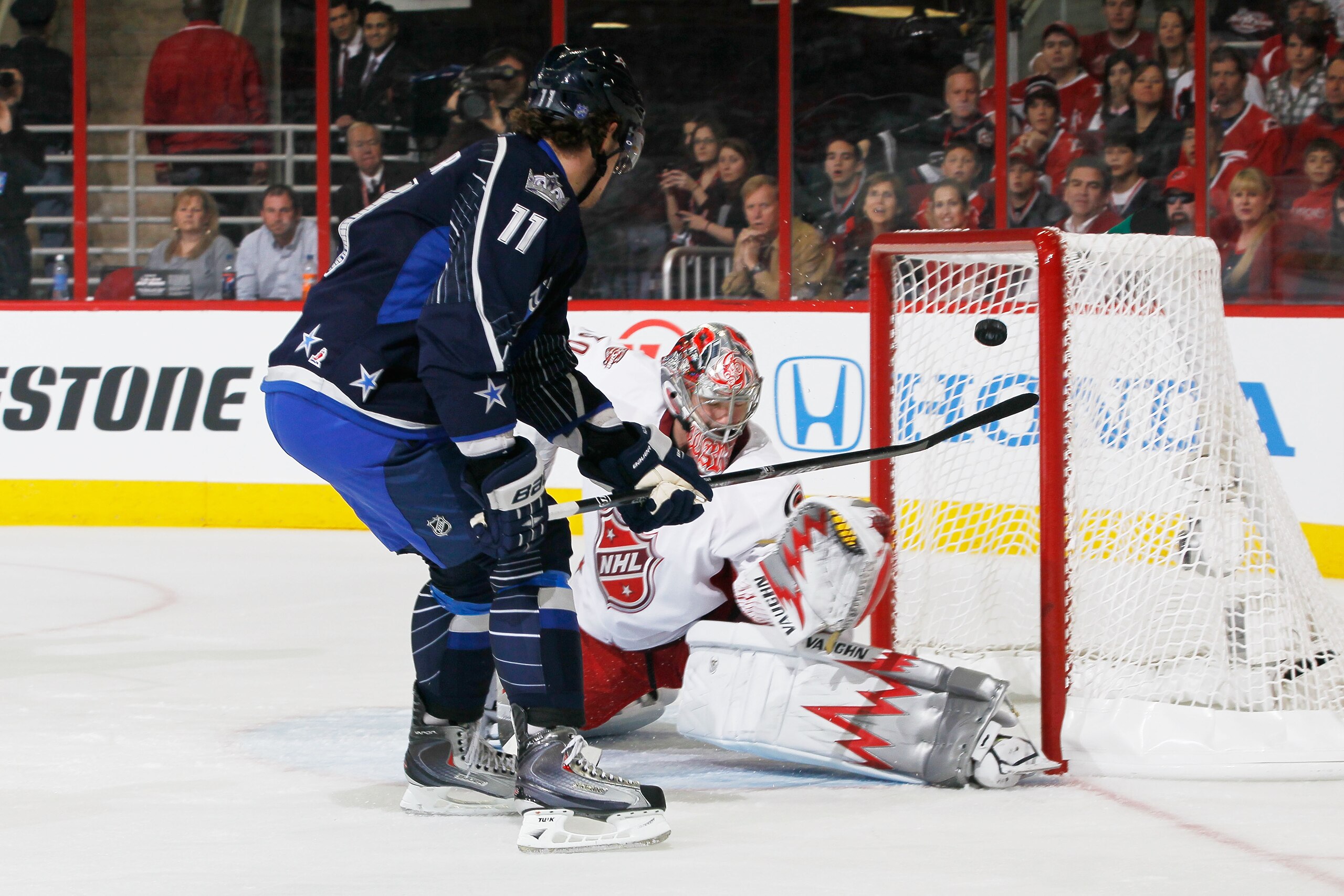 RALEIGH, NC - JANUARY 30:  Anze Kopitar #11 of the Los Angeles Kings and Team Lidstrom scores a goal on Cam Ward #30 of the Carolina Hurricanes and Team Staal in the 58th NHL All-Star Game at RBC Center on January 30, 2011 in Raleigh, North Carolina.  (Ph