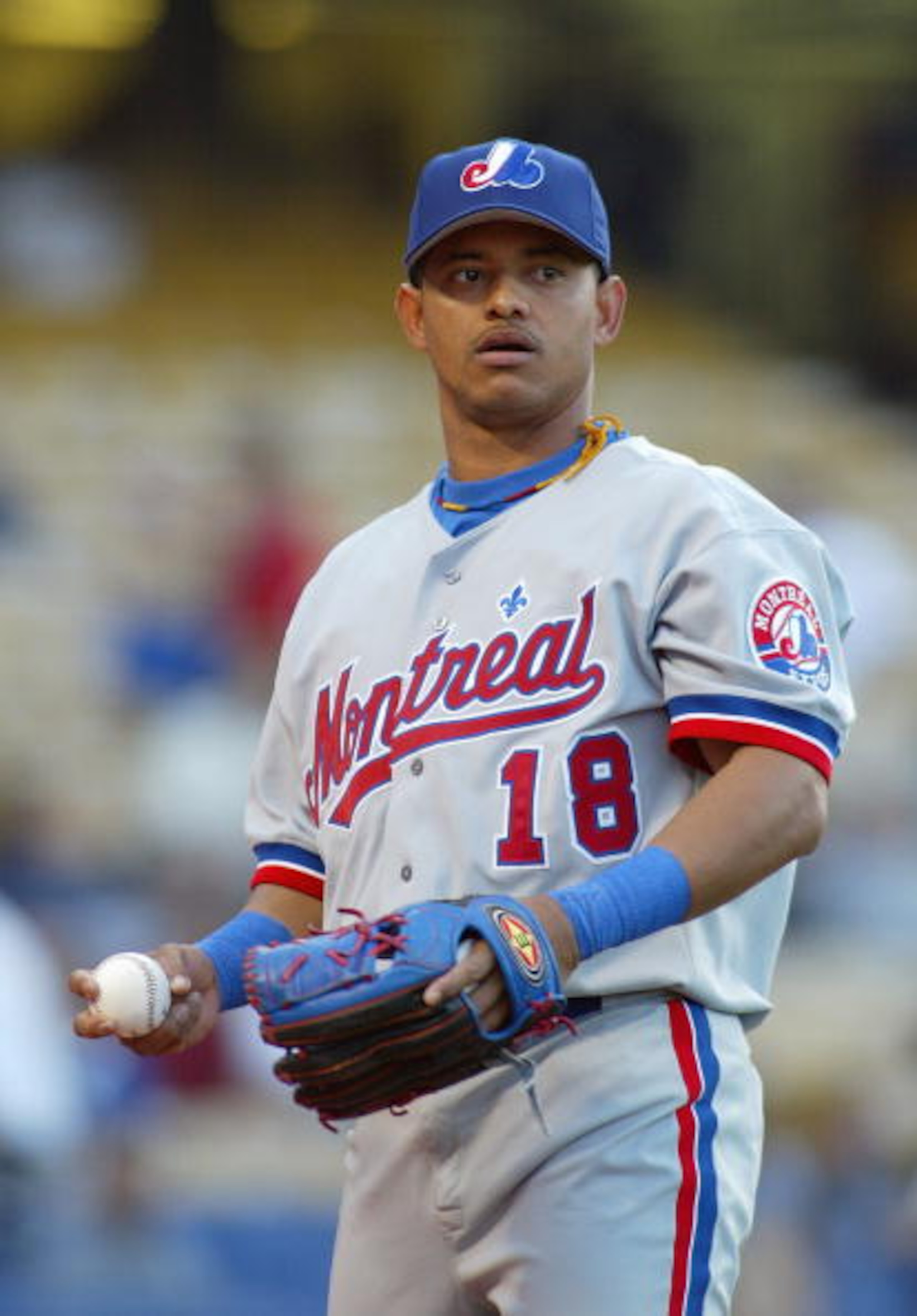 LOS ANGELES - APRIL 30:  Infielder Orlando Cabrera #18 of the Montreal Expos holds the ball during the game against the Los Angeles Dodgers at Dodger Stadium on April 30, 2004 in Los Angeles, California.  The Dodgers won 13-4.  (Photo by Lisa Blumenfeld/G