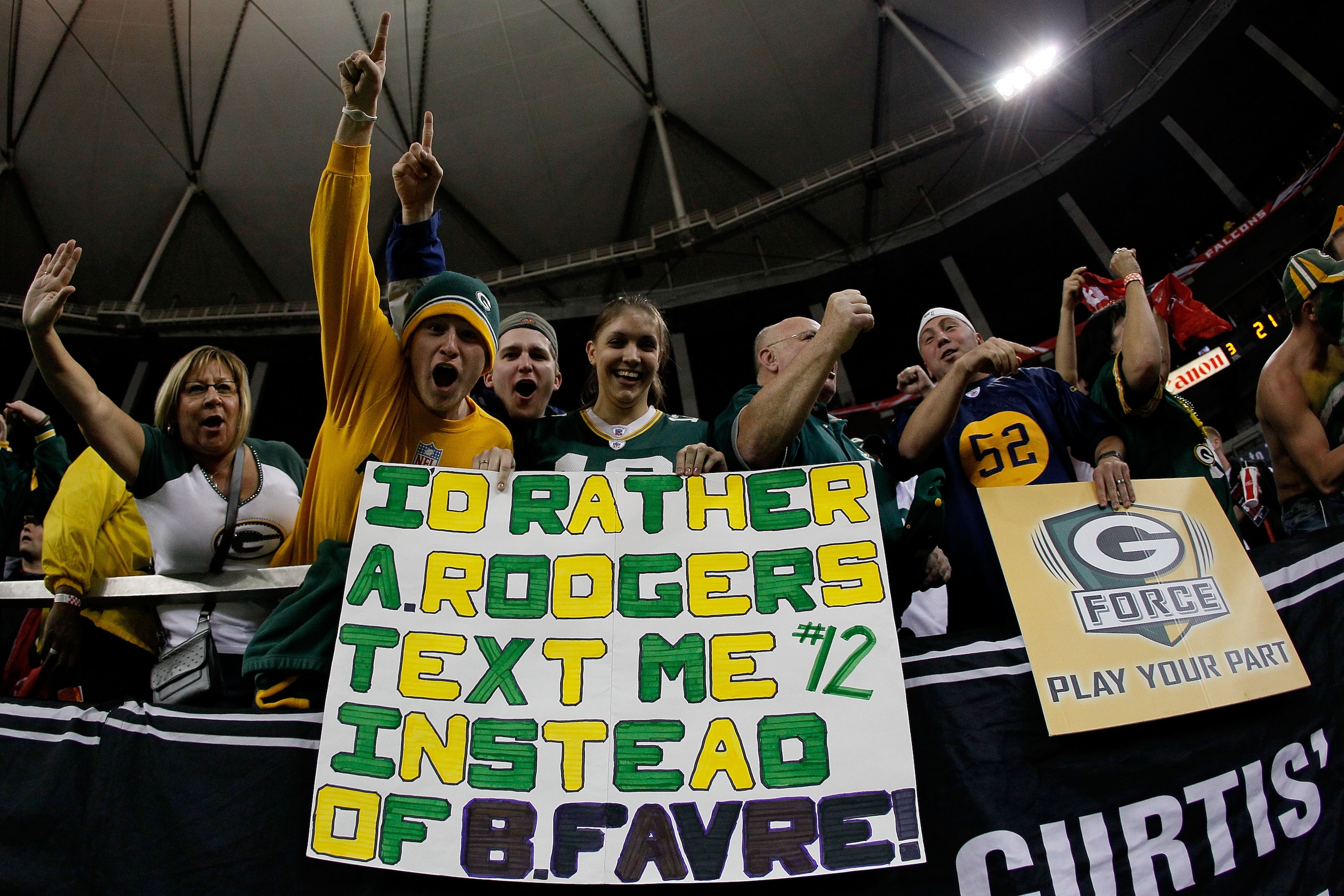 ATLANTA, GA - JANUARY 15:  Fans of the Green Bay Packers hold up a sign which reads 'I'd Rather Aaron Rodgers text me instead of Brett Favre after the Packers defeated the Atlanta Falcons 48-21 during their 2011 NFC divisional playoff game at Georgia Dome