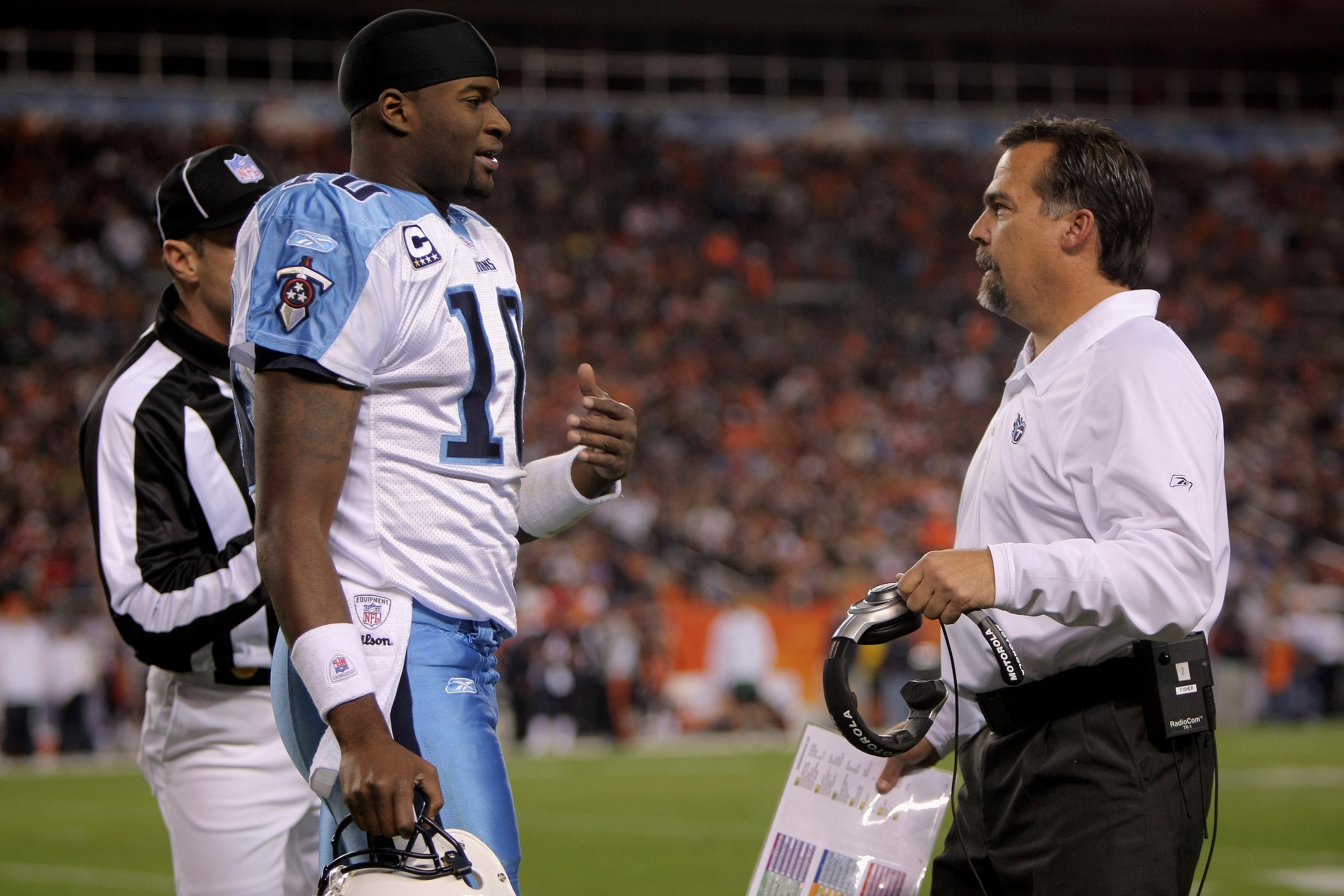 DENVER - NOVEMBER 19:  Quarterback Vince Young #10 calls a time out and confers with head coach Jeff Fisher of the Tennessee Titans during the game against the Denver Broncos at Invesco Field at Mile High November 19, 2007 in Denver, Colorado.  (Photo by