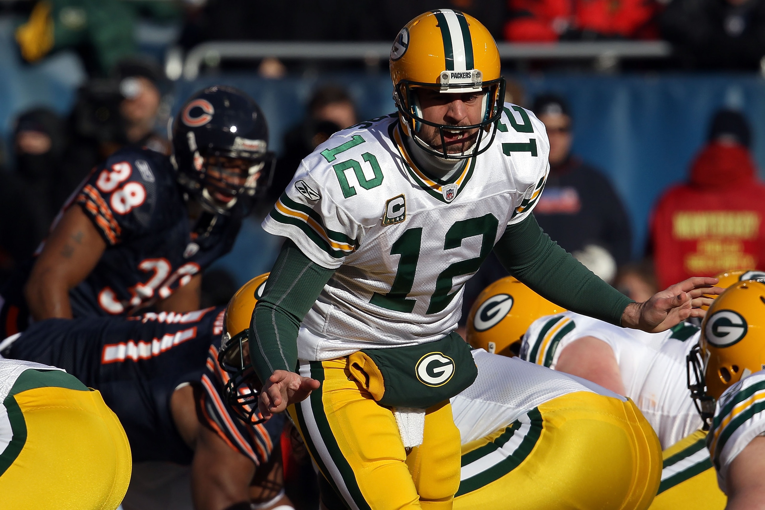 CHICAGO, IL - JANUARY 23:  Quarterback Aaron Rodgers #12 of the Green Bay Packers calls out from under center against the Chicago Bears in the NFC Championship Game at Soldier Field on January 23, 2011 in Chicago, Illinois.  (Photo by Jonathan Daniel/Gett