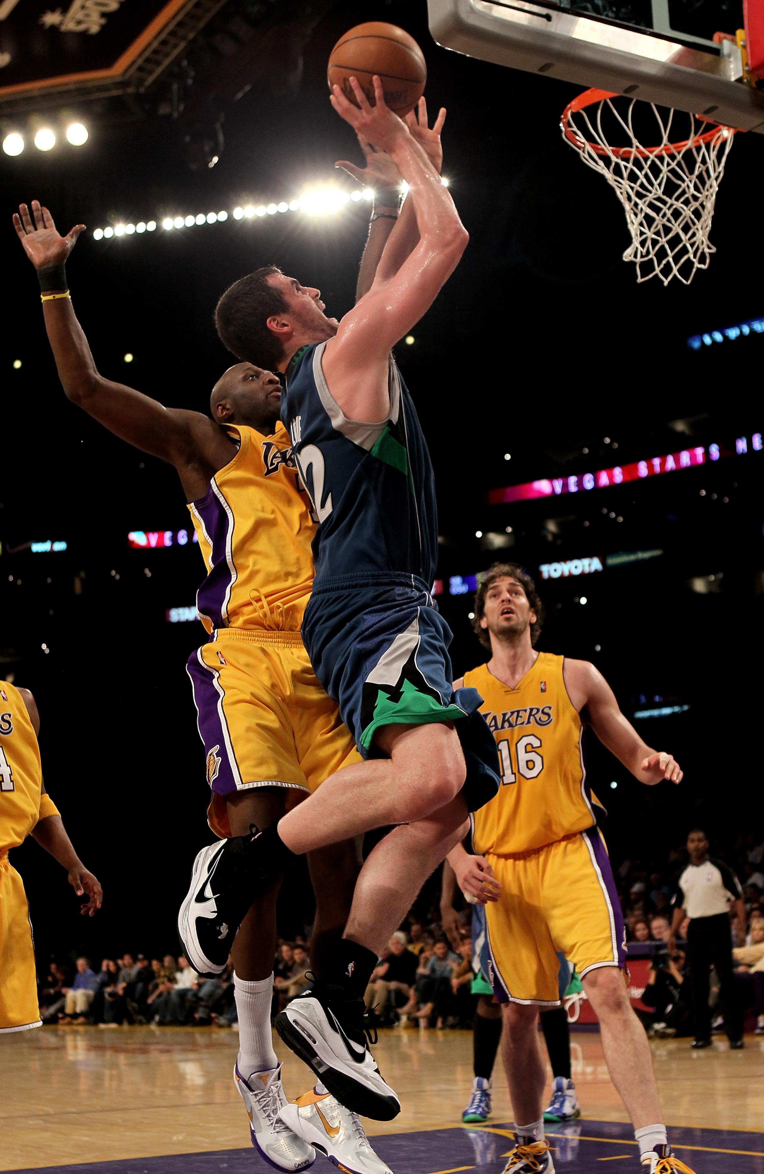 LOS ANGELES - MARCH 19:  Kevin LOve #42 of the Minnesota Timberwolves shoots over lamar Odom #7 of the Los Angeles Lakers on March 19, 2010 at Staples Center in Los Angeles, California.  The Lakeres won 104-96. NOTE TO USER: User expressly acknowledges an