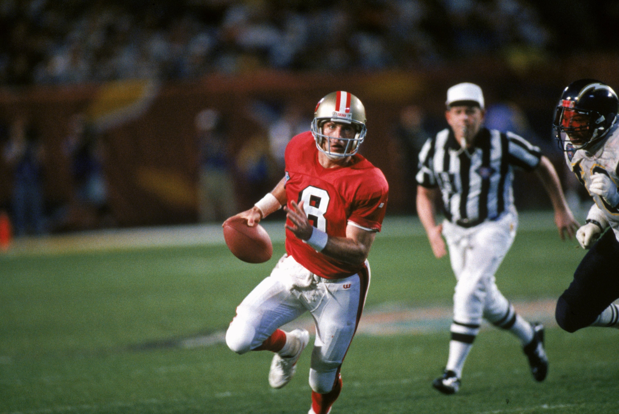 MIAMI - JANUARY 29: Quarterback Steve Young #8 of the San Francisco 49ers finds room to run with the ball during Super Bowl XXIX against the San Diego Chargers at Joe Robbie Stadium on January 29, 1995 in Miami, Florida. The 49ers won 49-26. (Photo by Ge MIAMI - JANUARY 29: Quarterback Steve Young #8 of the San Francisco 49ers finds room to run with the ball during Super Bowl XXIX against the San Diego Chargers at Joe Robbie Stadium on January 29, 1995 in Miami, Florida. The 49ers won 49-26. (Photo by Ge