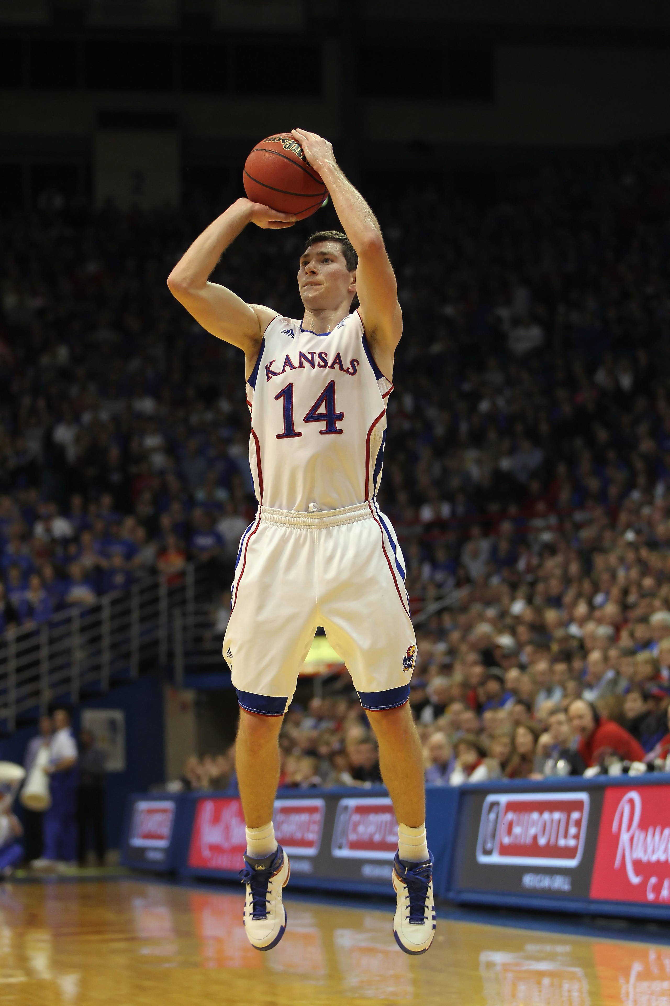 LAWRENCE, KS - DECEMBER 29:  Tyrel Reed #14 of the Kansas Jayhawks in action during the game against the University of Texas Arlington Mavericks on December 29, 2010 at Allen Fieldhouse in Lawrence, Kansas.  (Photo by Jamie Squire/Getty Images)