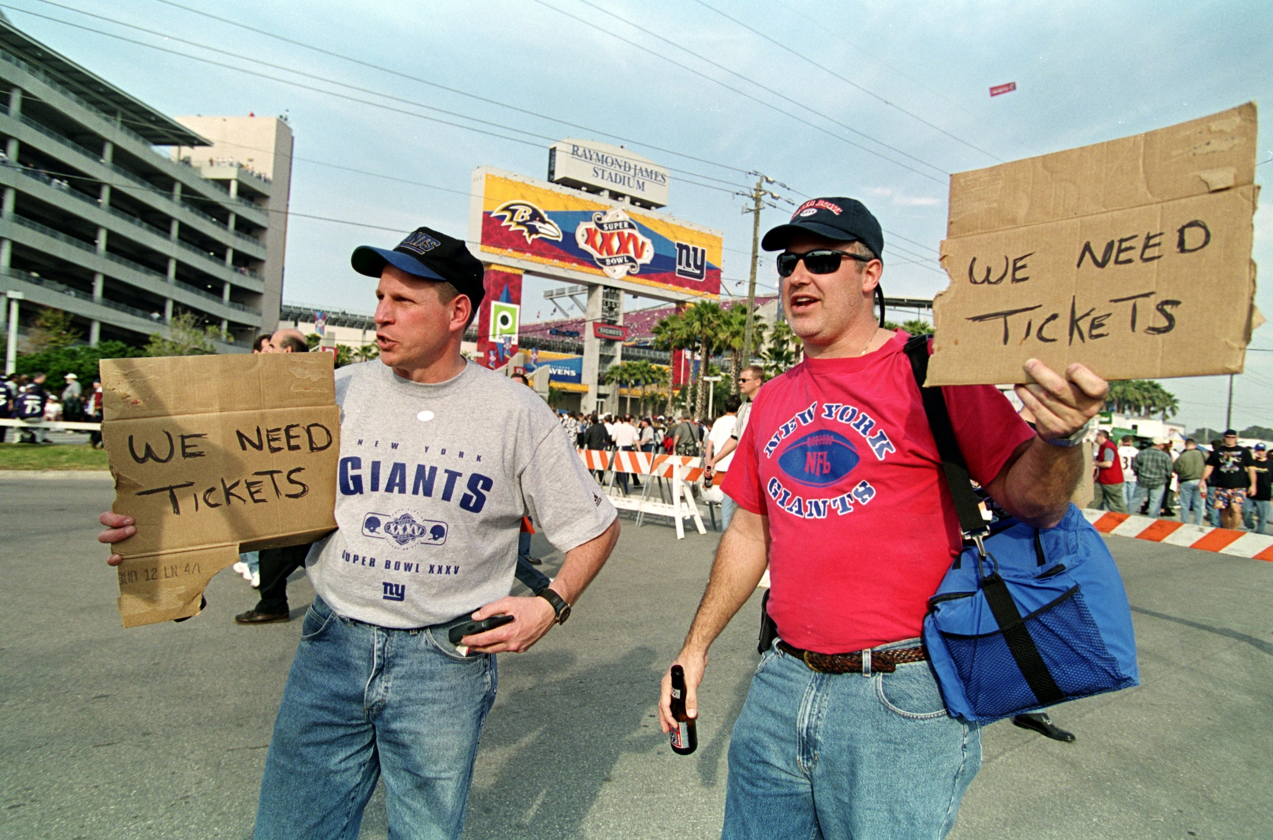 28 Jan 2001: Fans of the New York Giants hold signs looking for tickets before the Super Bowl XXXV Game against the Baltimore Ravens at the Raymond James Stadium in Tampa, Florida. The Ravens defeated the Giants 34-7.Mandatory Credit: Jonathan Daniel /A 28 Jan 2001: Fans of the New York Giants hold signs looking for tickets before the Super Bowl XXXV Game against the Baltimore Ravens at the Raymond James Stadium in Tampa, Florida. The Ravens defeated the Giants 34-7.Mandatory Credit: Jonathan Daniel /A