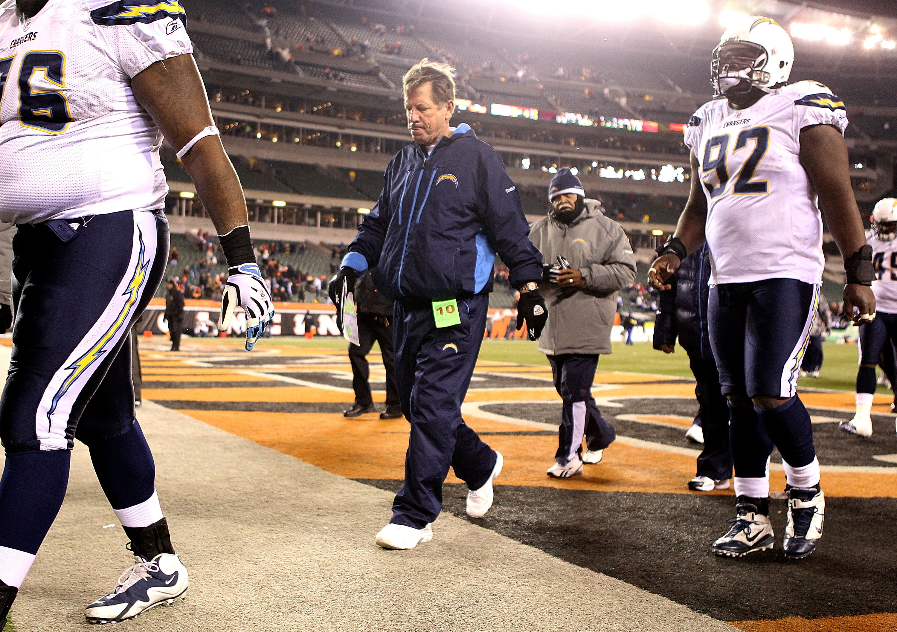 CINCINNATI - DECEMBER 26: Norv Turner (center) the Head Coach of the San Diego Chargers walks off of the field following the Chargers 34-20 loss to the Cincinnati Bengals during the NFL game at Paul Brown Stadium on December 26, 2010 in Cincinnati, Ohio.