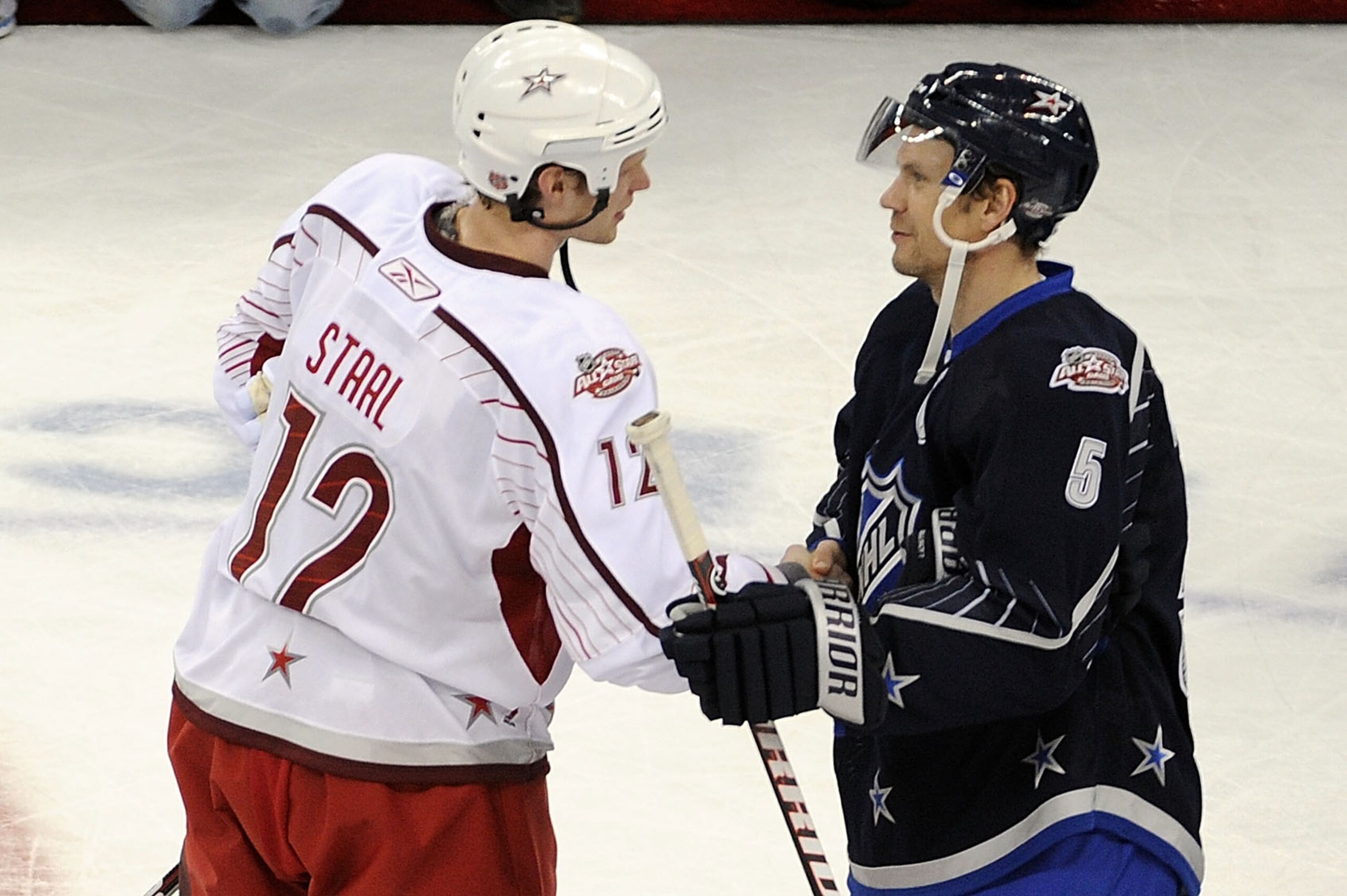 RALEIGH, NC - JANUARY 30:  Team Lidstrom captain Nicklas Lidstrom #5 of the Detroit Red Wings shakes hands with Team Staal captain Eric Staal #12 of the Carolina Hurricanes after Team Lidstrom defeated Team Staal 11 to 10 in the 58th NHL All-Star Game at