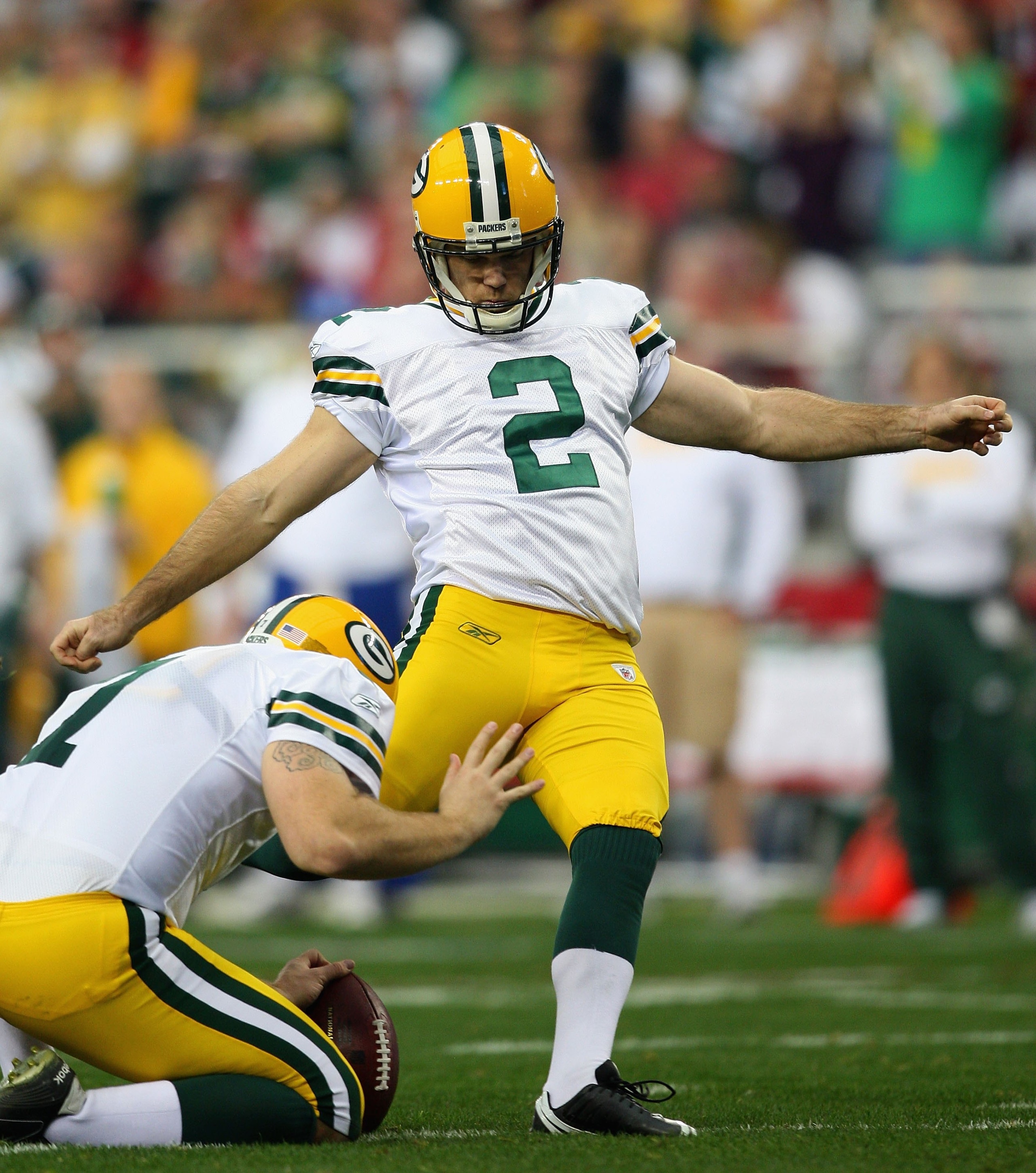 GLENDALE, AZ - JANUARY 03: Kicker Mason Crosby #2 of the Green Bay Packers kicks a field goal during the NFL game against the Arizona Cardinals at the Universtity of Phoenix Stadium on January 3, 2010 in Glendale, Arizona. The Packers defeated the Cardi GLENDALE, AZ - JANUARY 03: Kicker Mason Crosby #2 of the Green Bay Packers kicks a field goal during the NFL game against the Arizona Cardinals at the Universtity of Phoenix Stadium on January 3, 2010 in Glendale, Arizona. The Packers defeated the Cardi