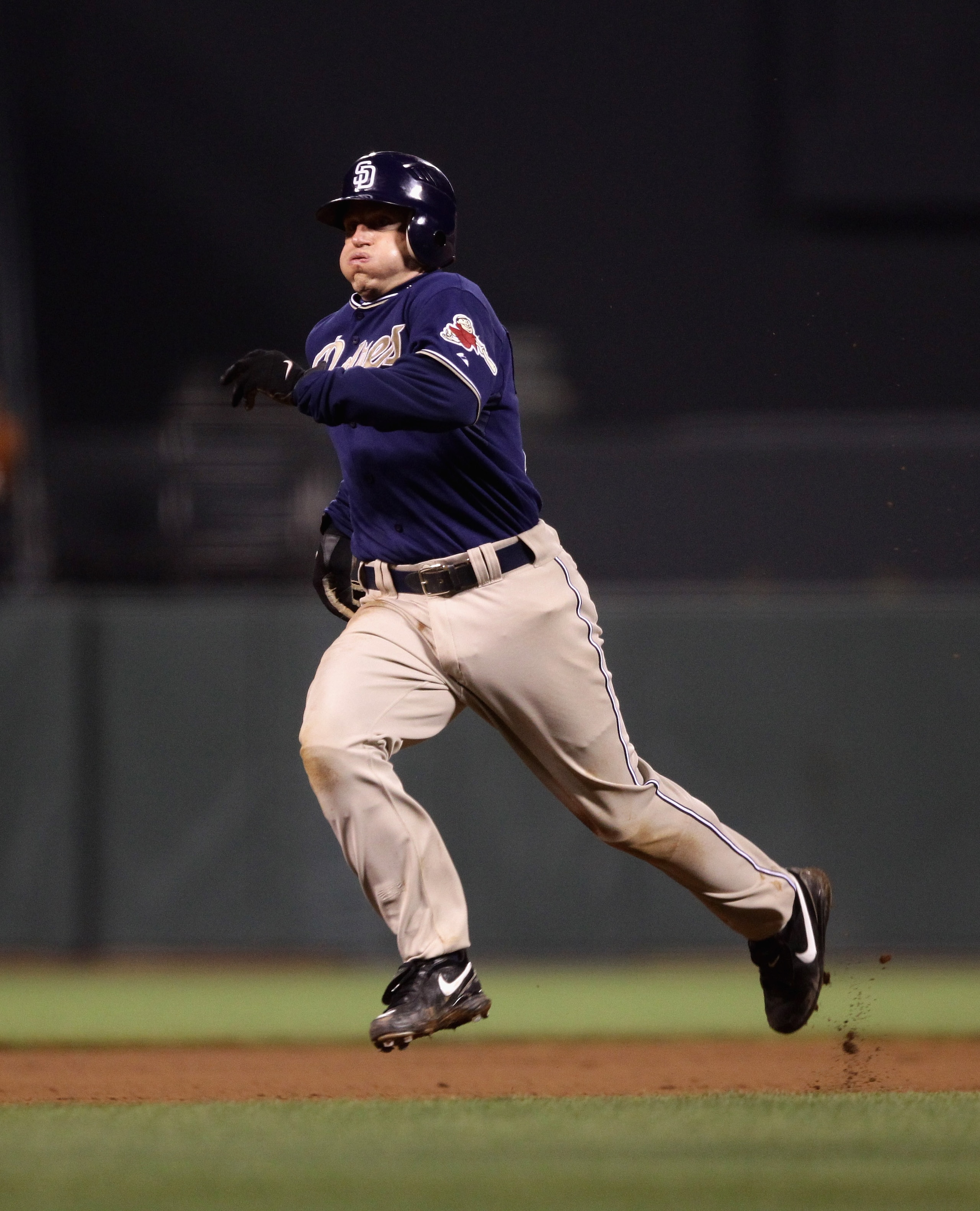 SAN FRANCISCO - OCTOBER 01:   David Eckstein #22 of the San Diego Padres runs to third base during their game against the San Francisco Giants at AT&T Park on October 1, 2010 in San Francisco, California.  (Photo by Ezra Shaw/Getty Images)