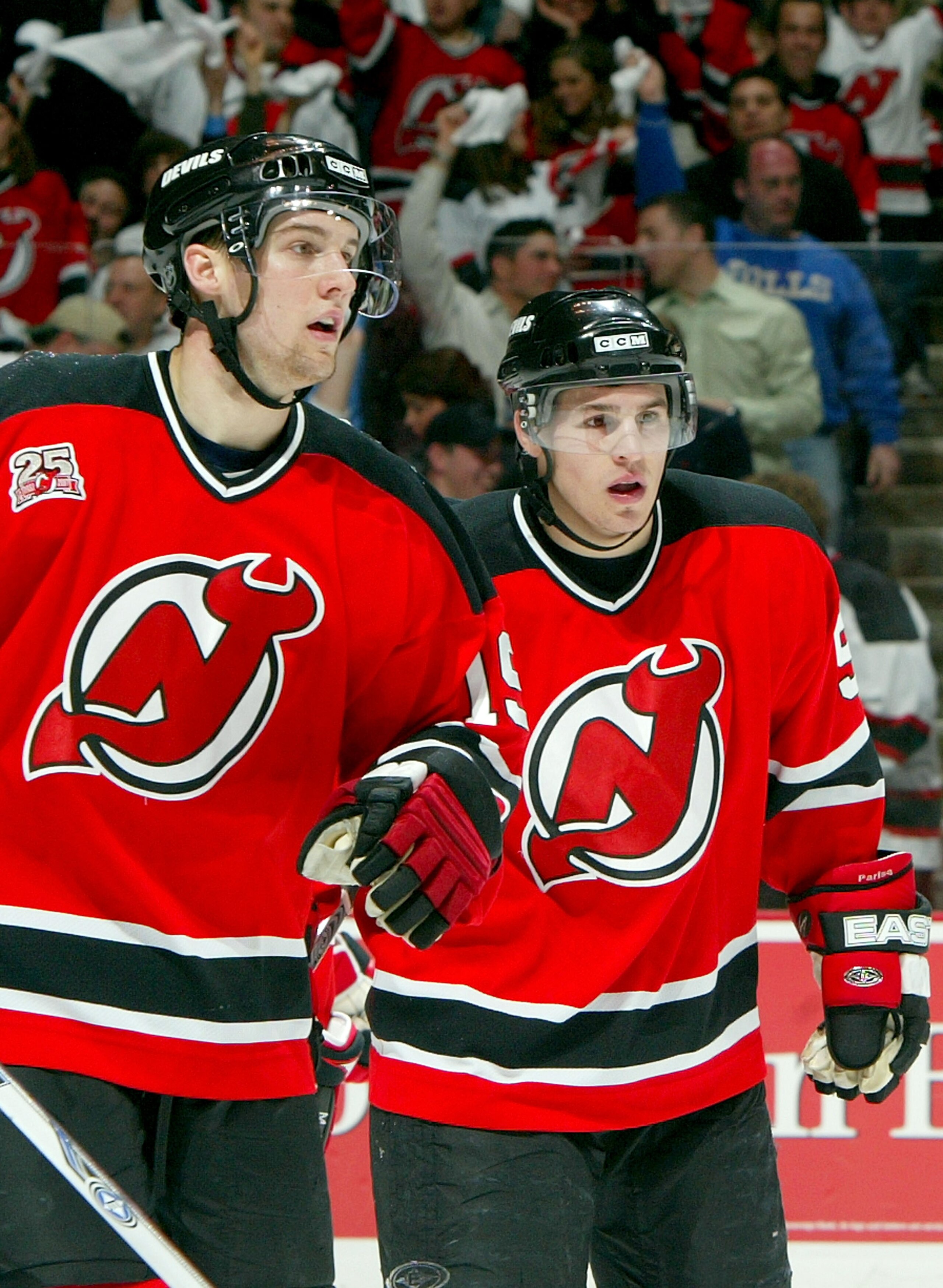EAST RUTHERFORD, NJ - APRIL 14:  Travis Zajac #19 (L) and Zach Parise #9 of the New Jersey Devils (R) skate to the bench after Parise scored a goal in the first period of Game 2 of the 2007 Eastern Conference Quarterfinals against the Tampa Bay Lightning